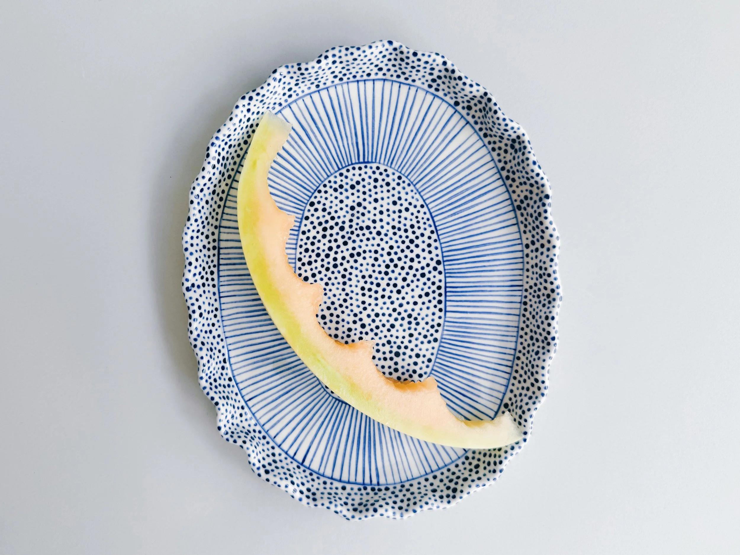 Blue and white, handmade ceramic plate.