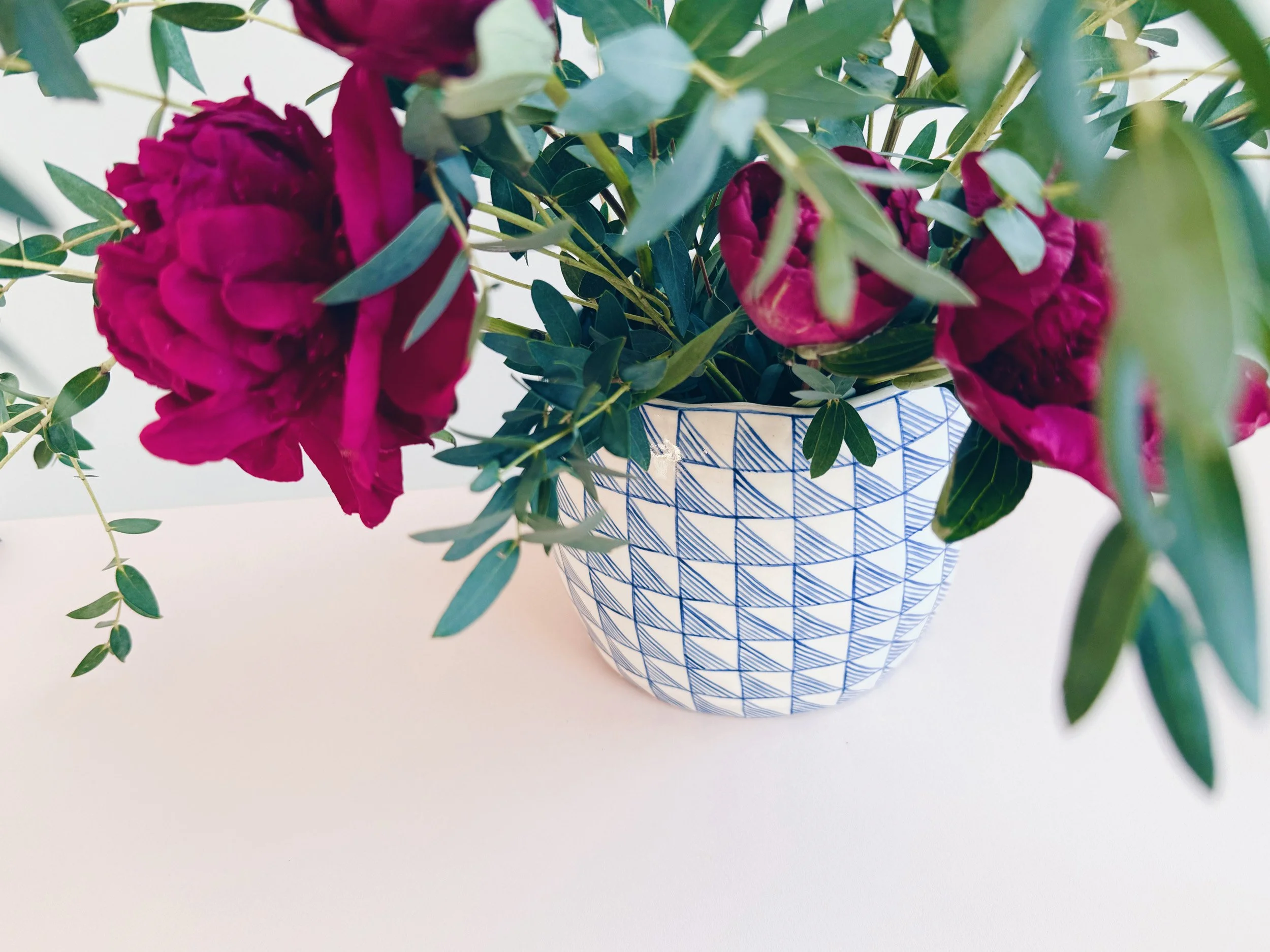 Blue and white, handmade ceramic vase.