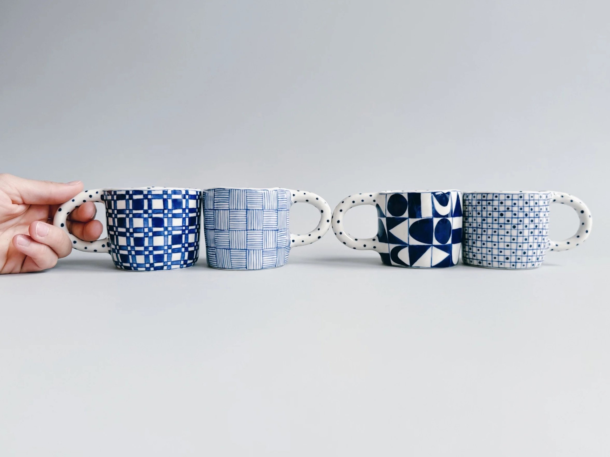 Blue and white, handmade ceramic mug.