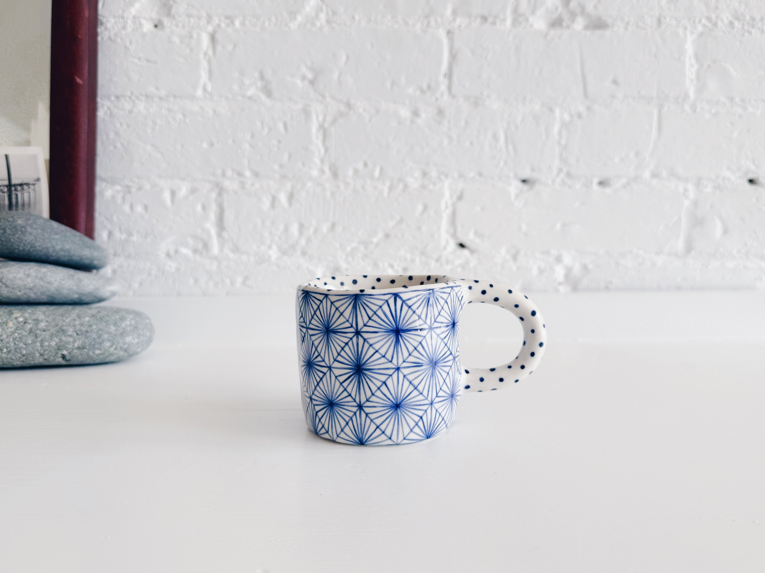 Blue and white, handmade ceramic mug.