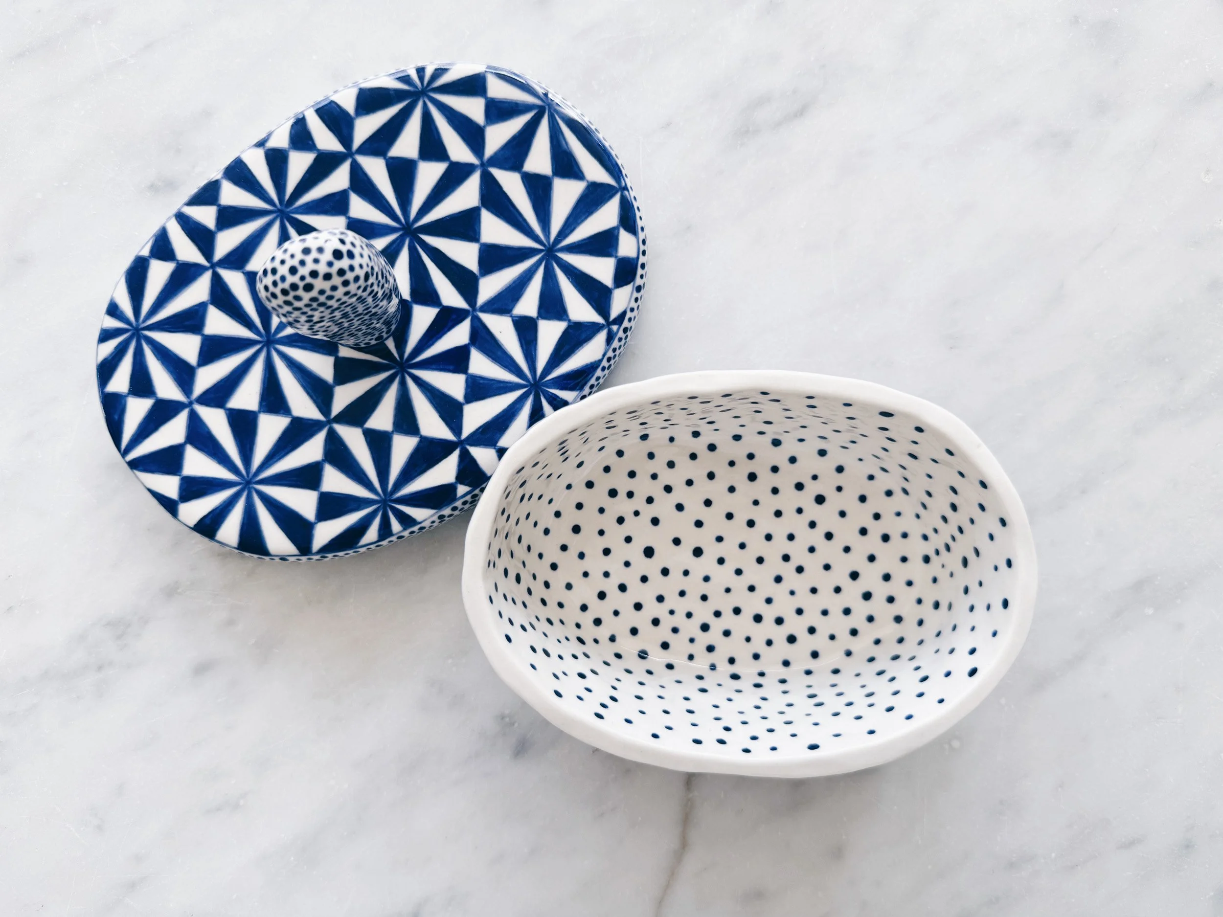 Blue and white, handmade ceramic jar.