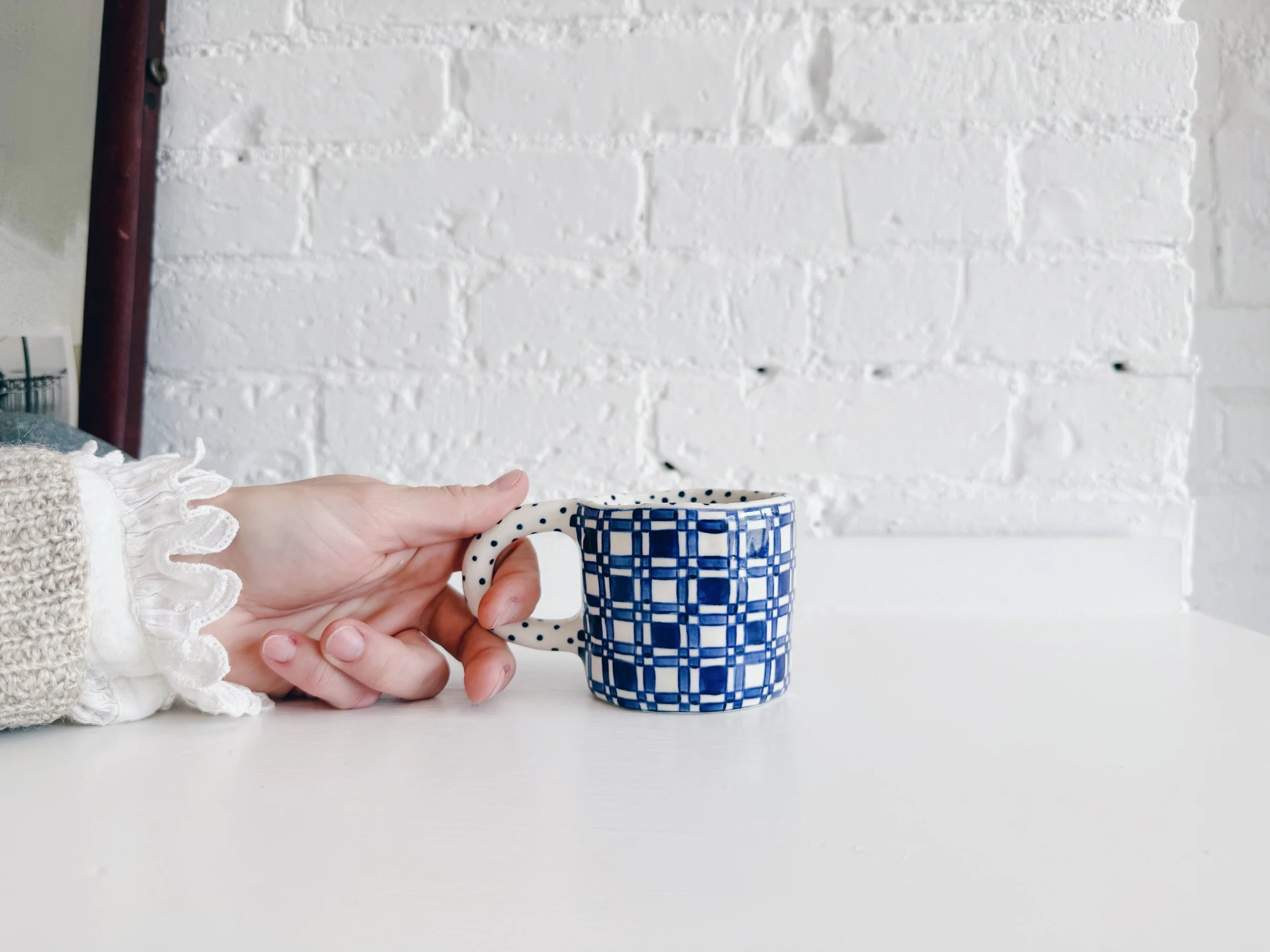 Blue and white, handmade ceramic mug.