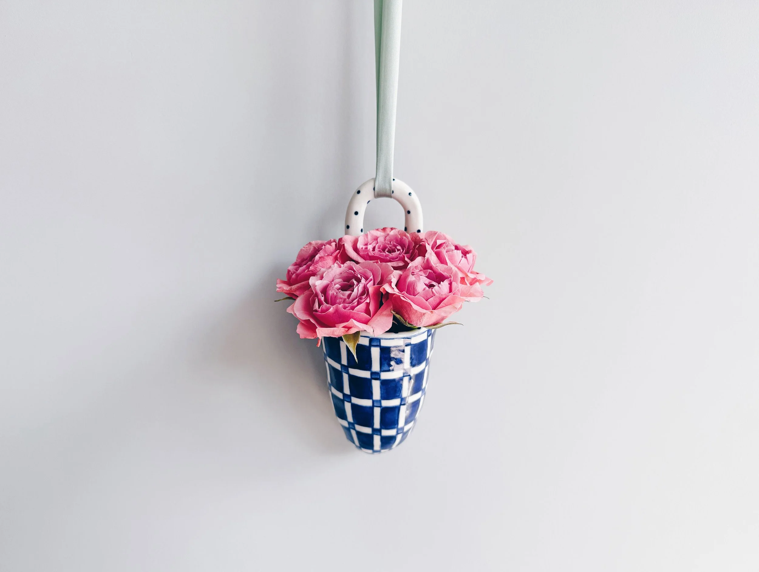 Blue and white, handmade ceramic vessel.