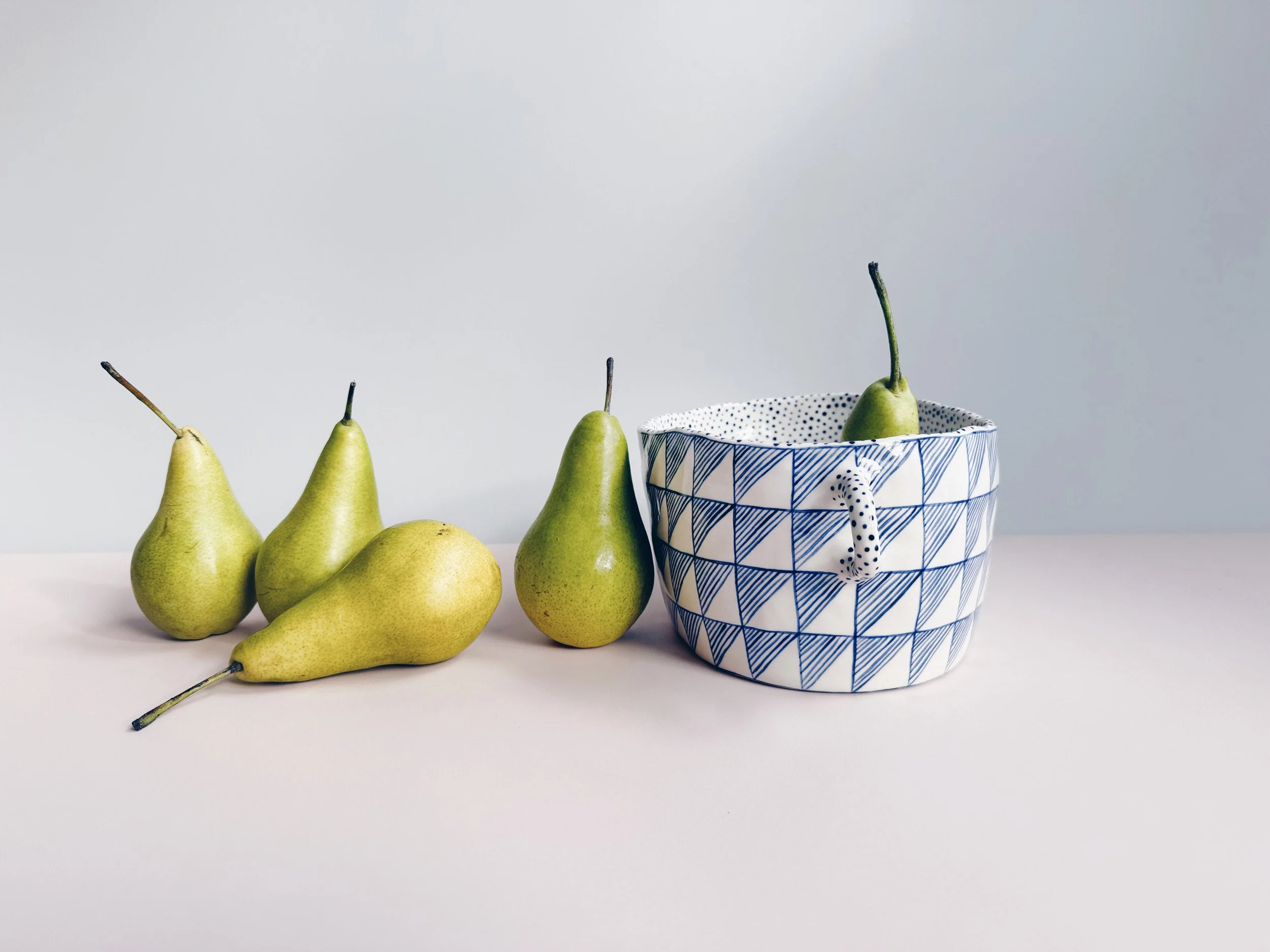 Blue and white, handmade ceramic vessel.