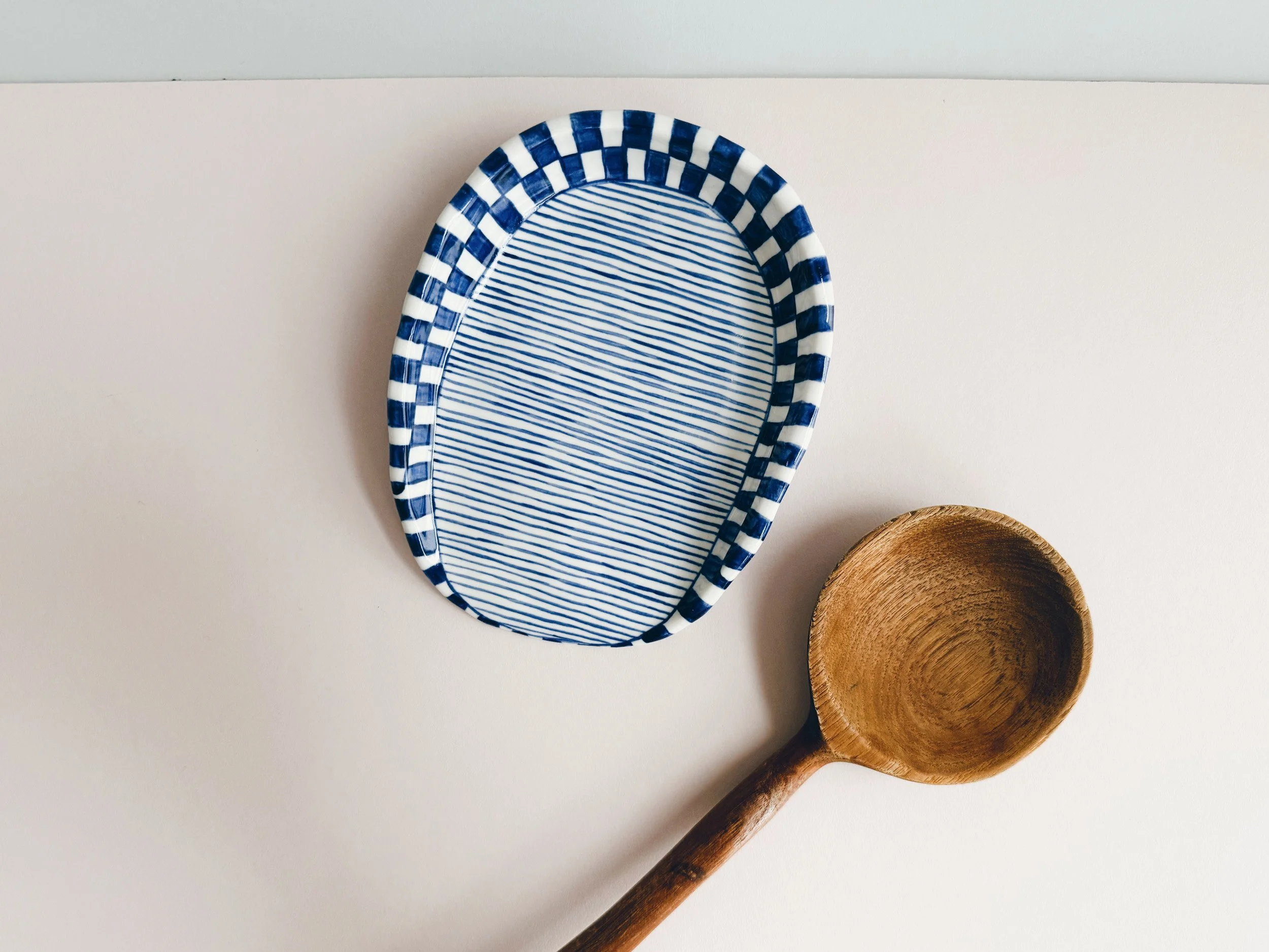 Blue and white, handmade ceramic spoon rest.