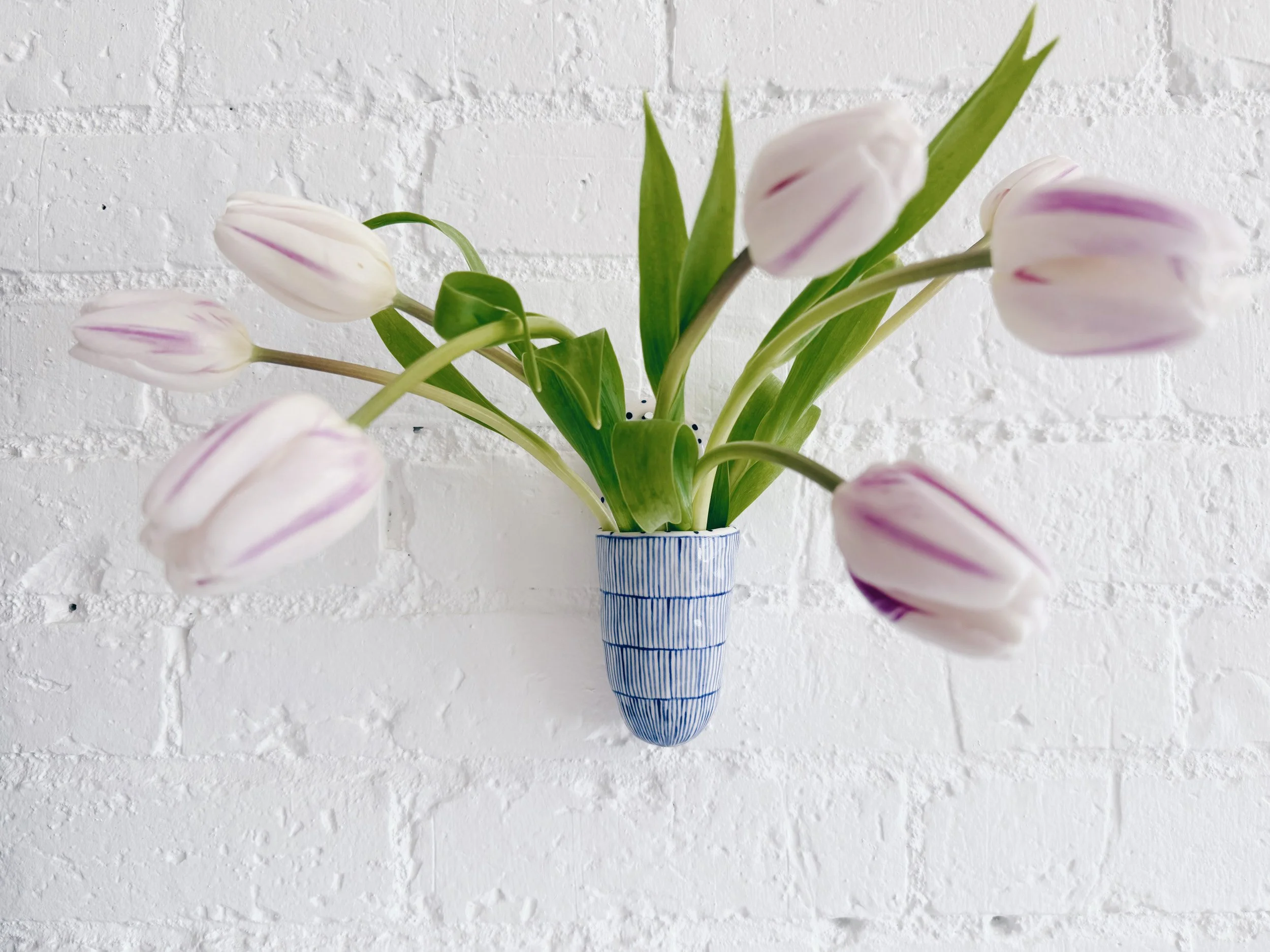 Blue and white, handmade ceramic vessel.