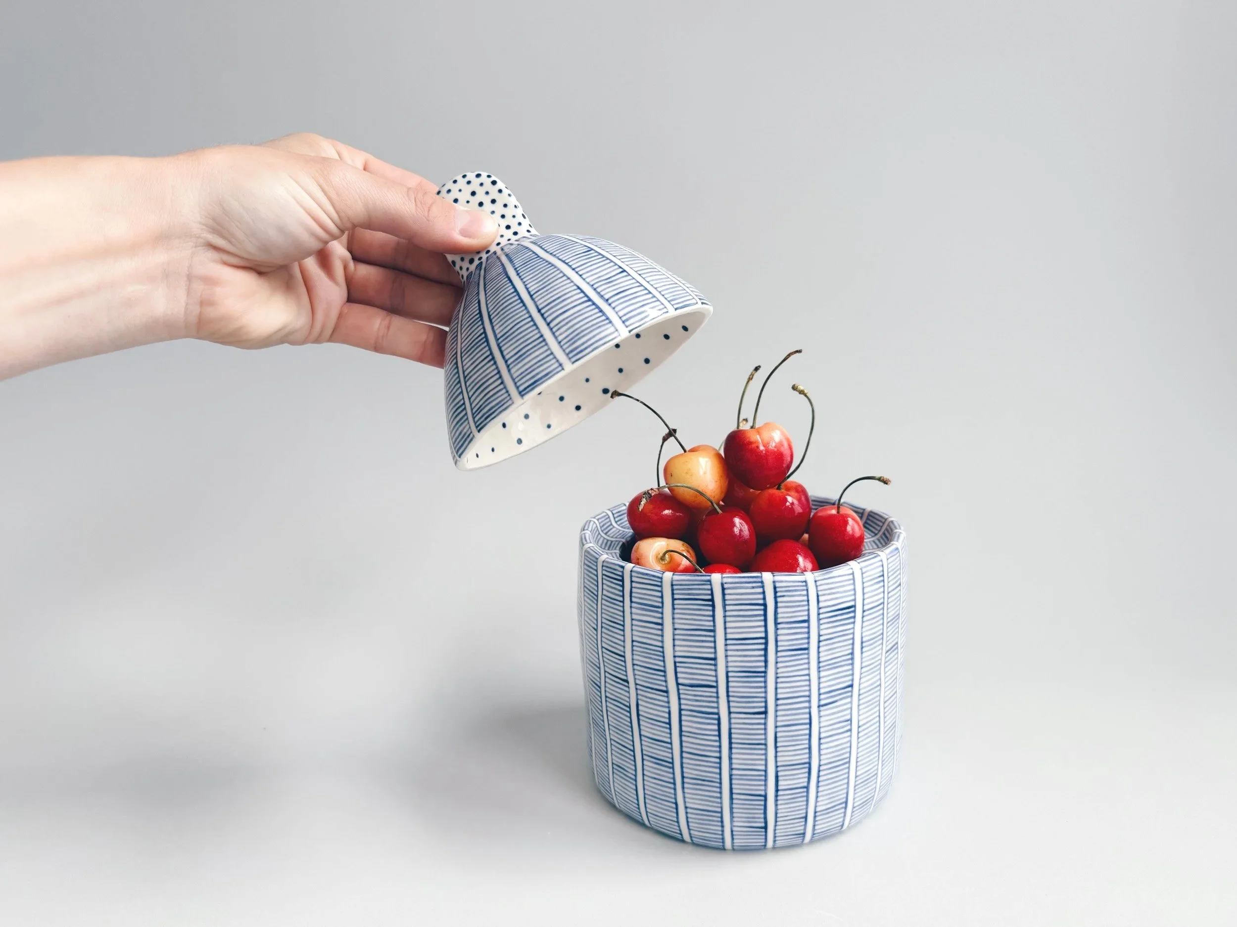 Blue and white, handmade ceramic jar.