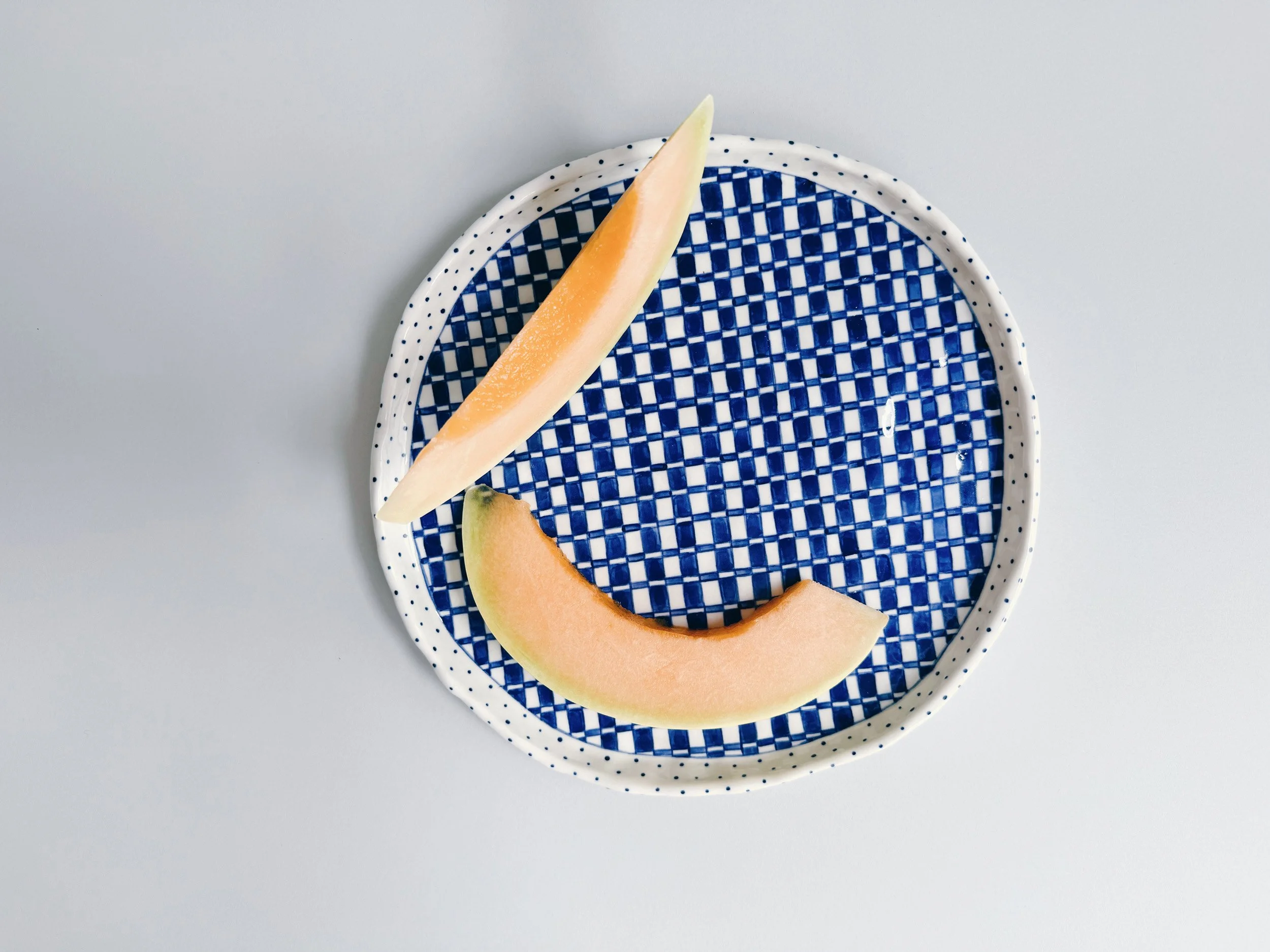 Blue and white, handmade ceramic plate.
