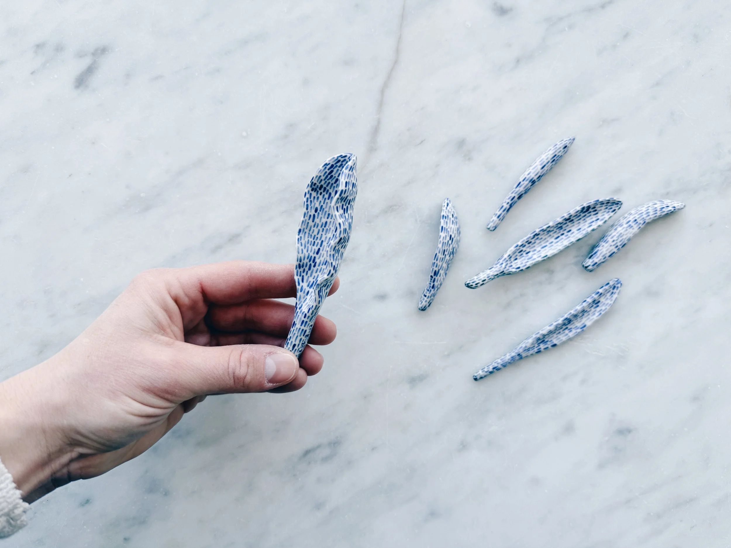 Blue and white, handmade ceramic sculpture.