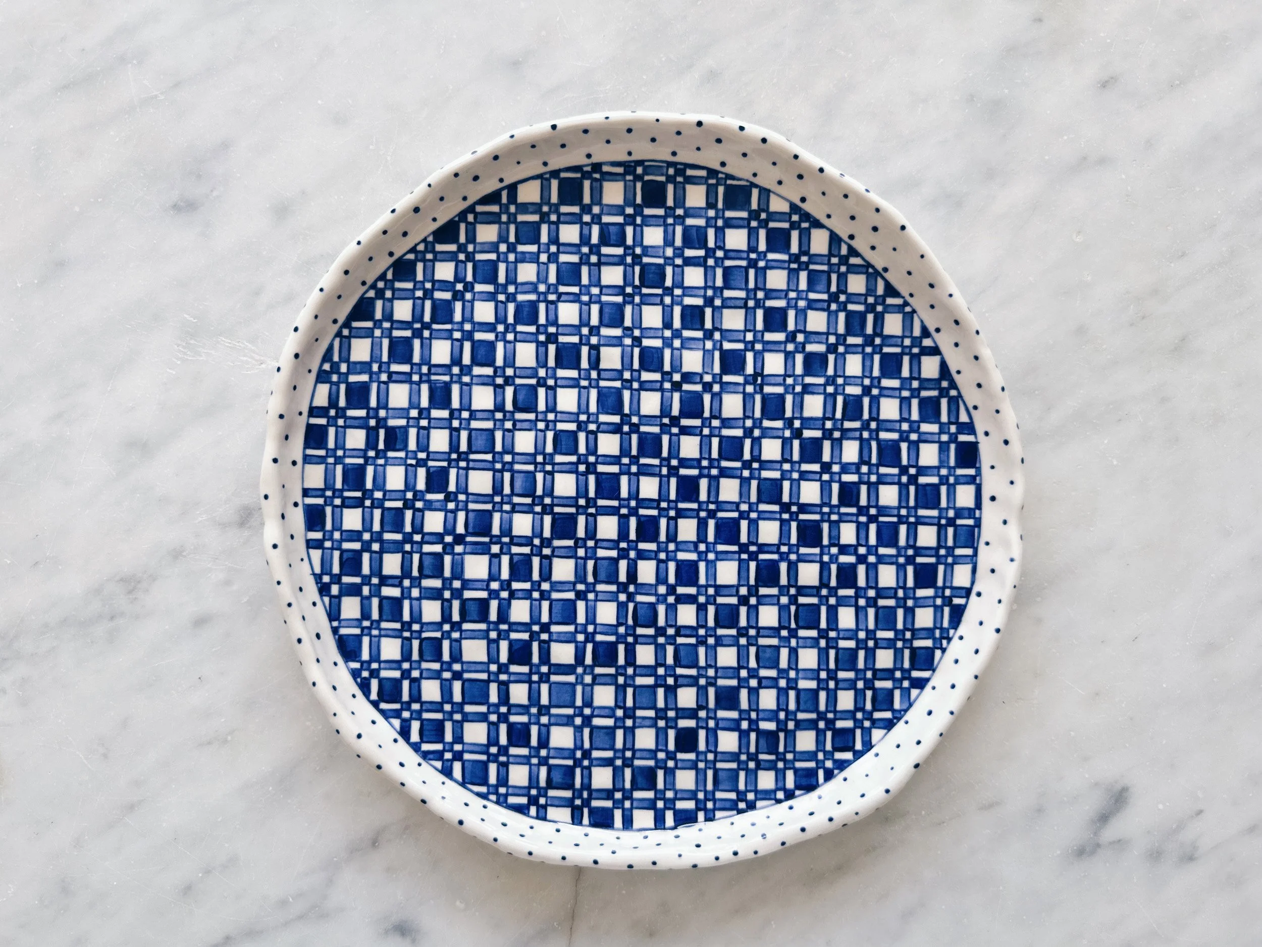 Blue and white, handmade ceramic plate.
