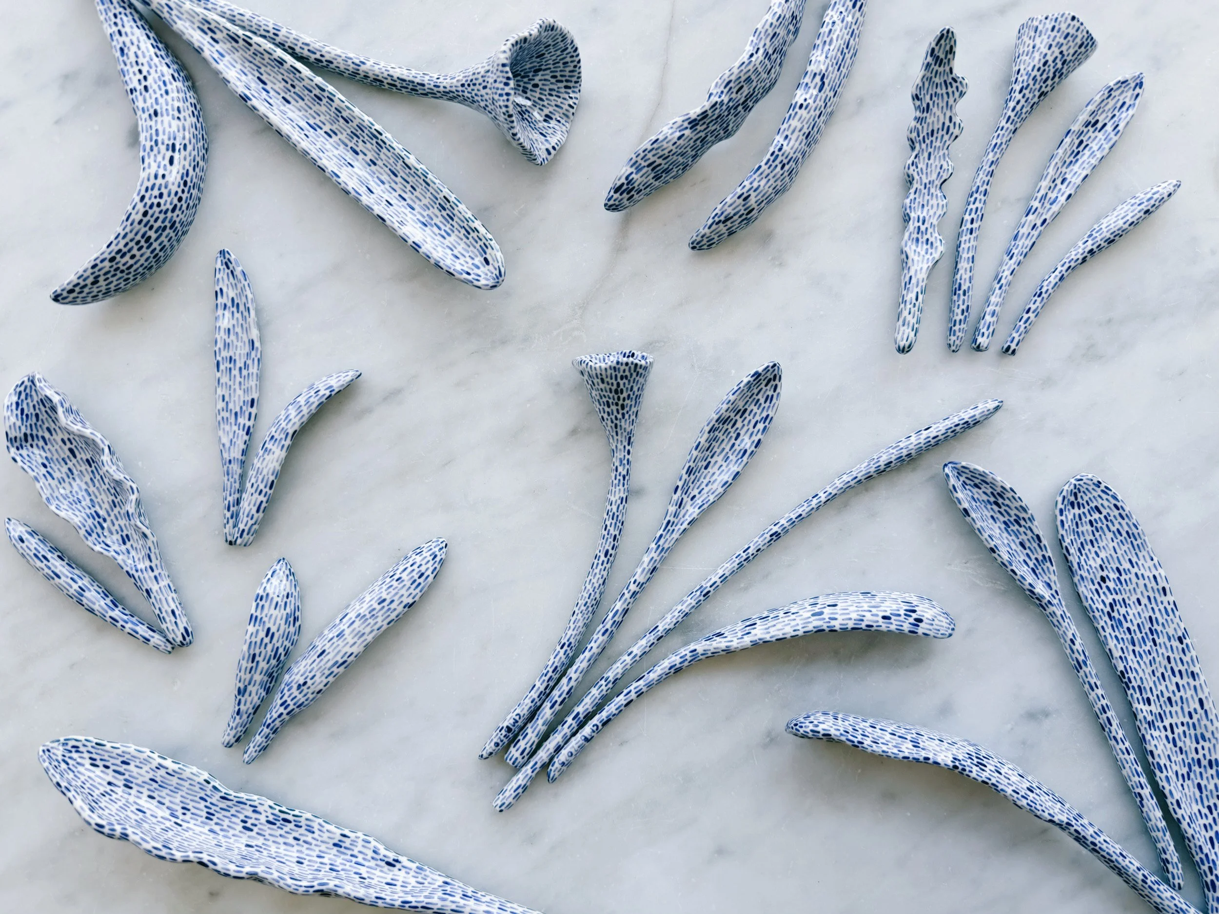 Blue and white, handmade ceramic sculpture.