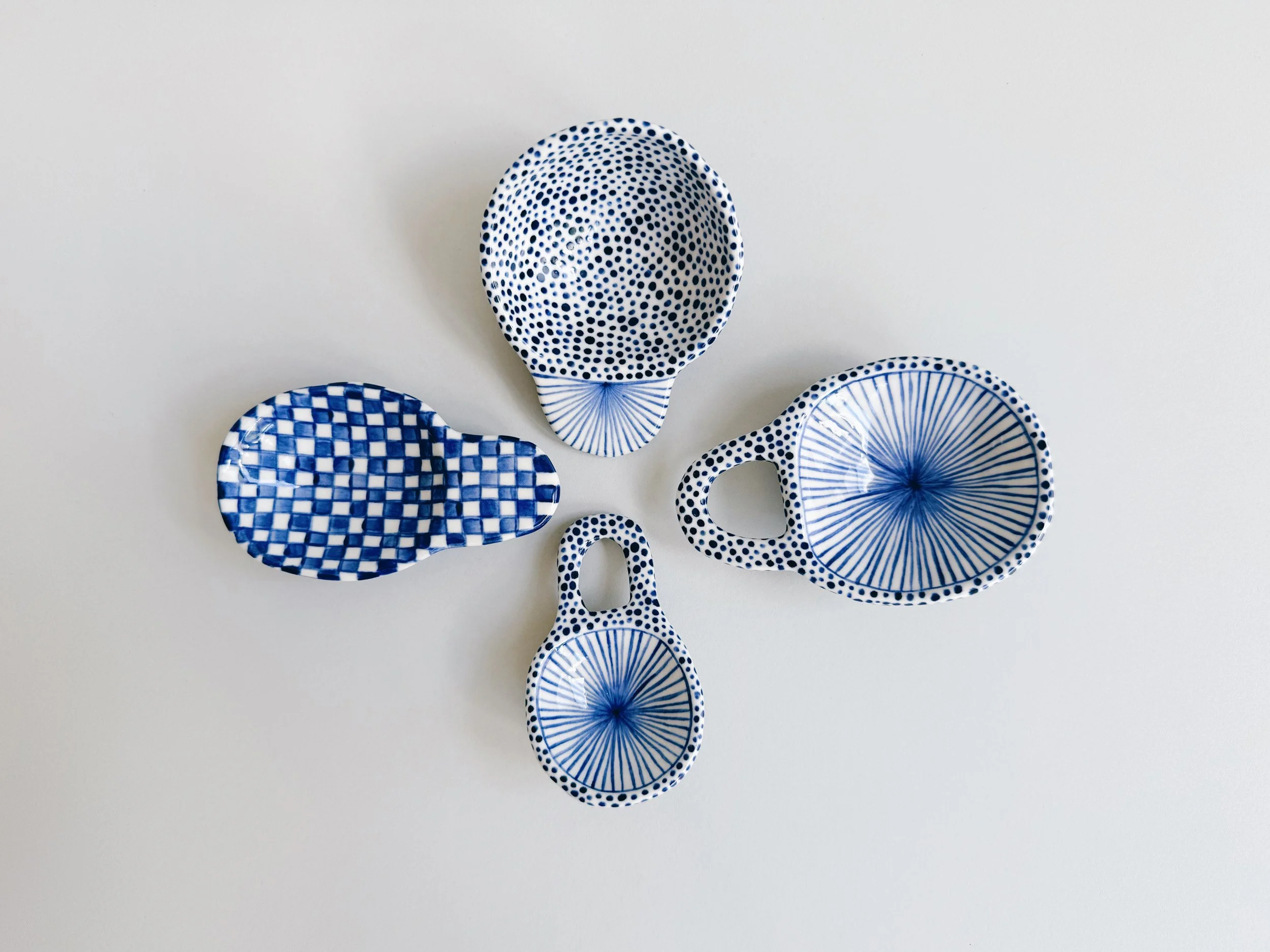 Blue and white, handmade ceramic scoop.