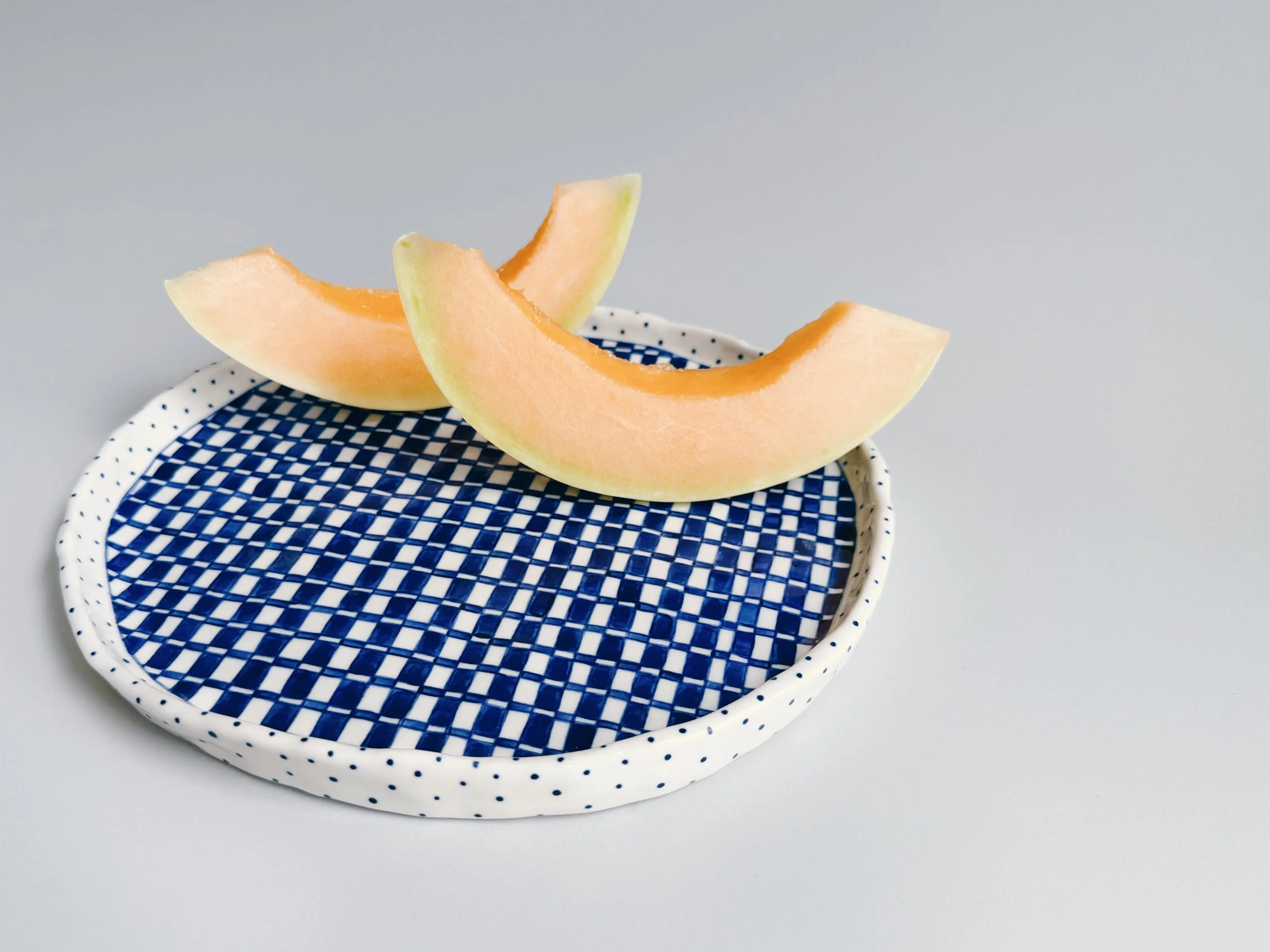 Blue and white, handmade ceramic plate.