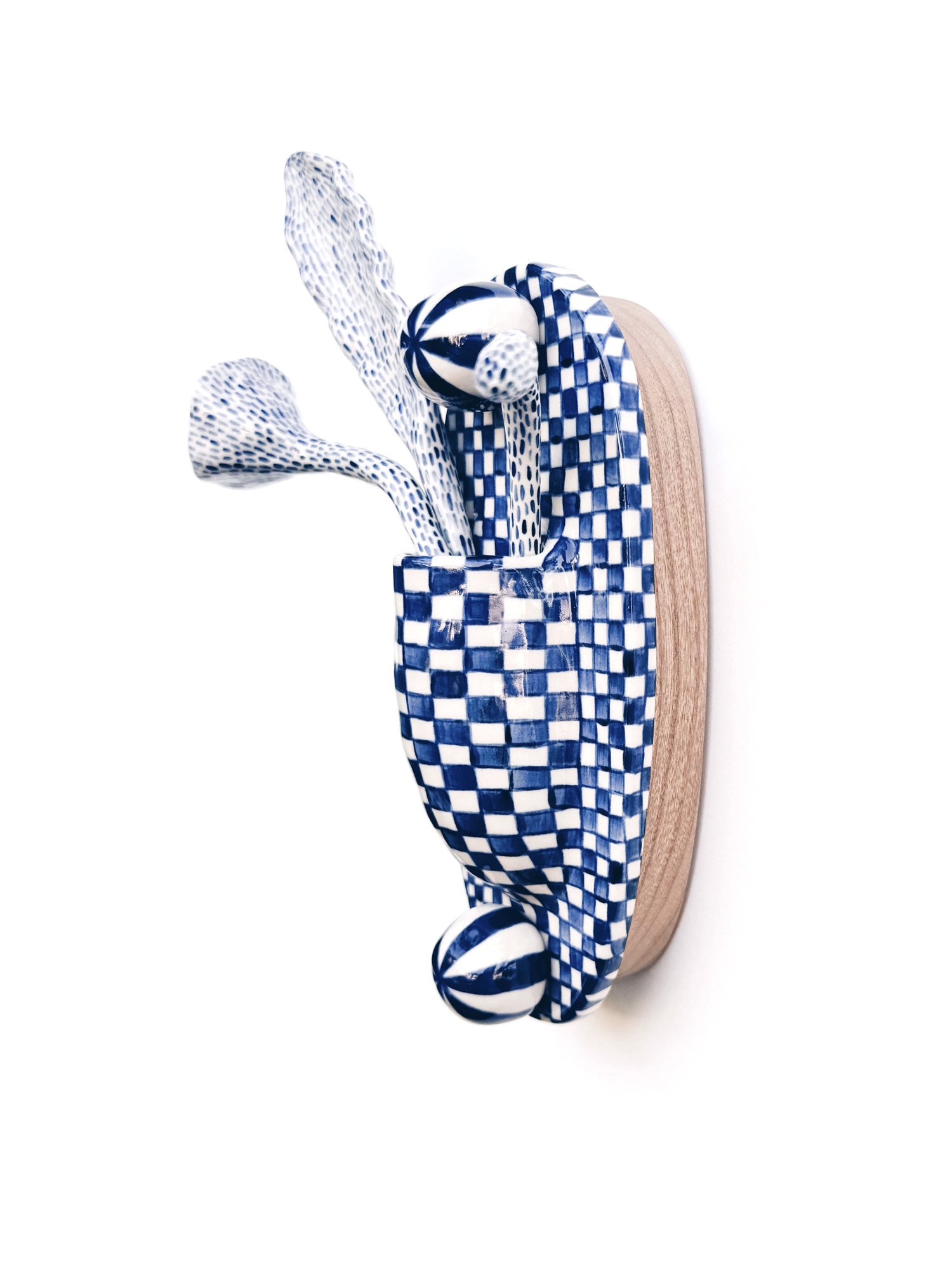 Blue and white, handmade ceramic wall hanging.