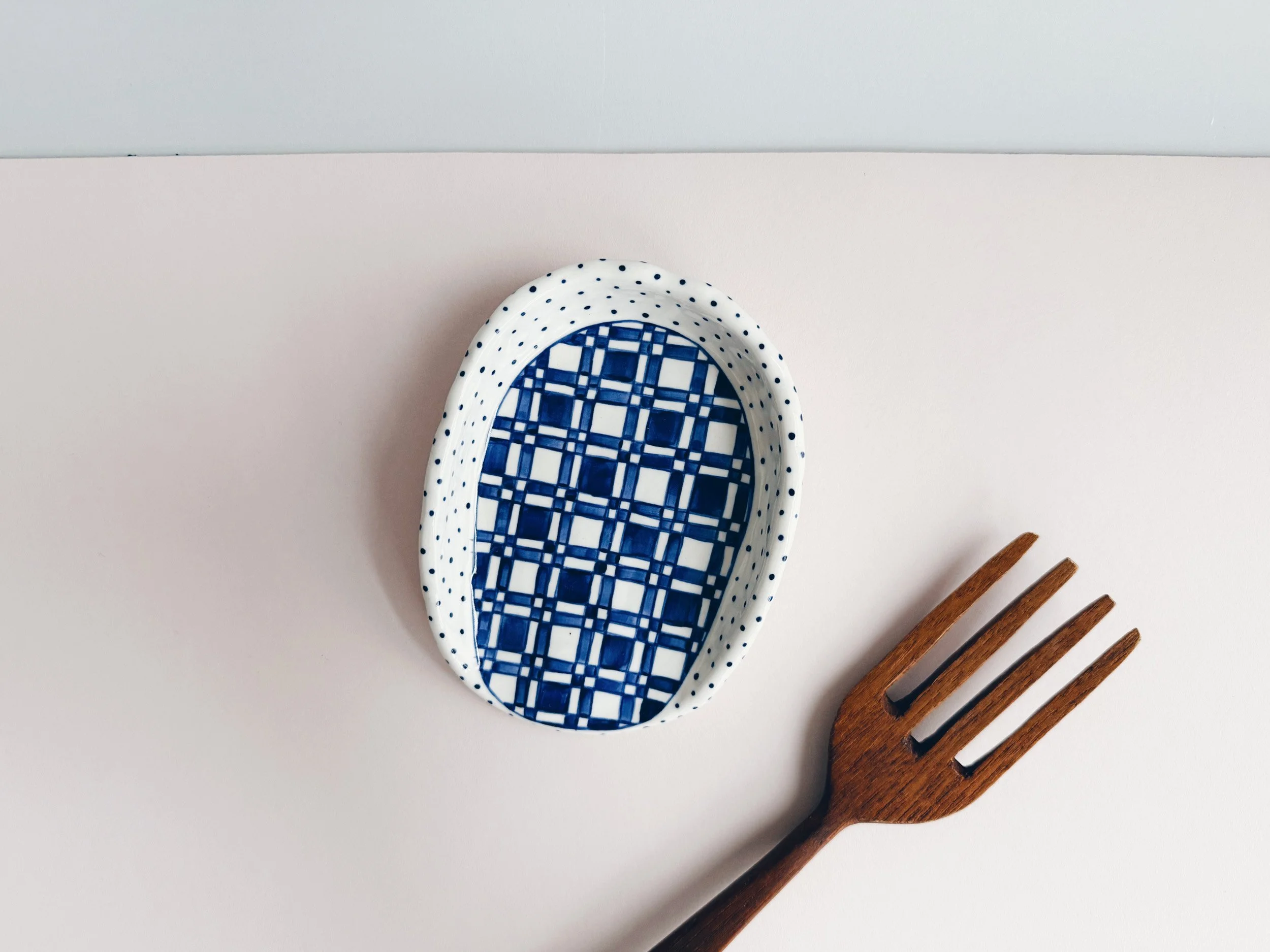 Blue and white, handmade ceramic spoon rest.