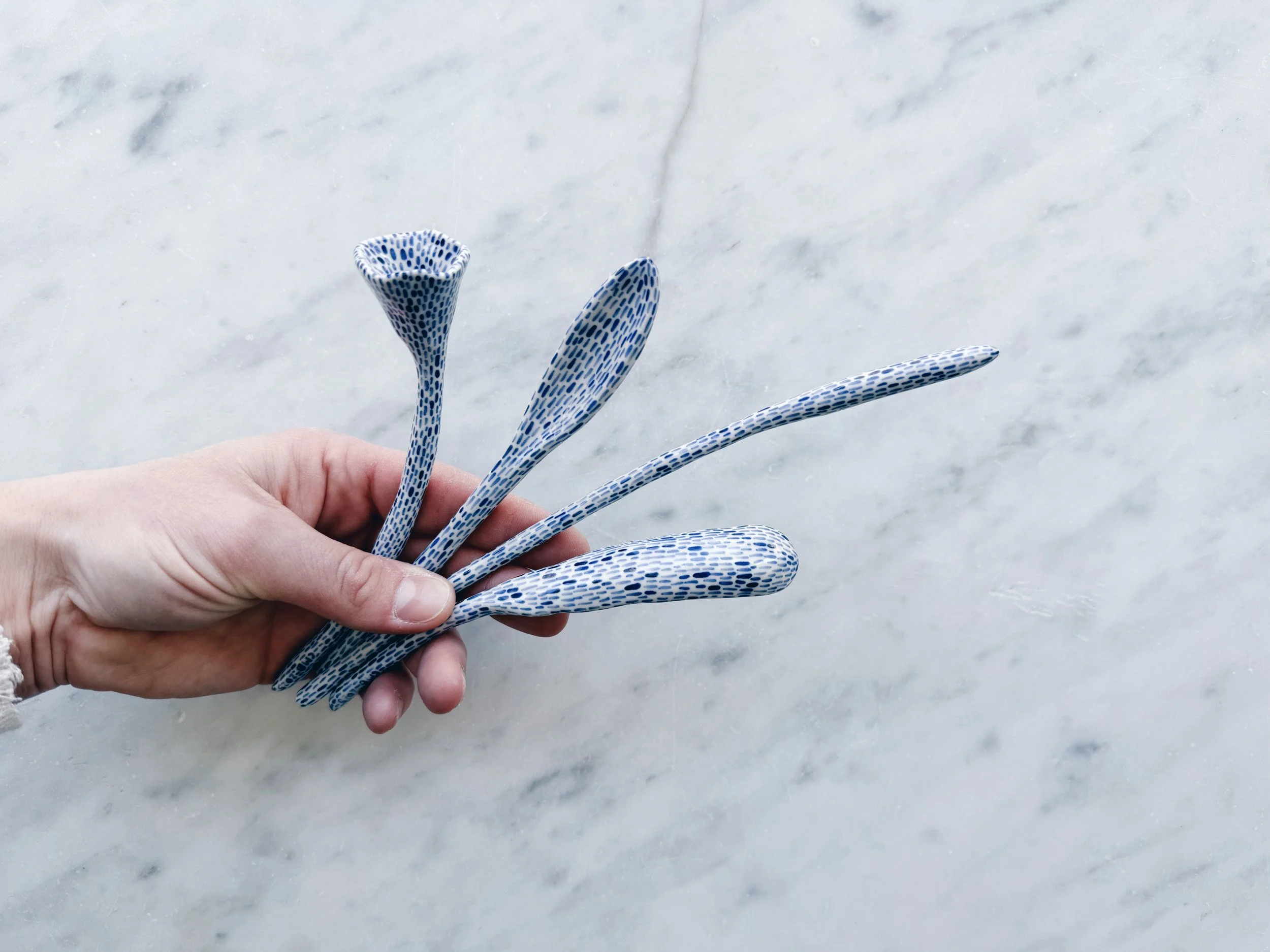 Blue and white, handmade ceramic sculpture.