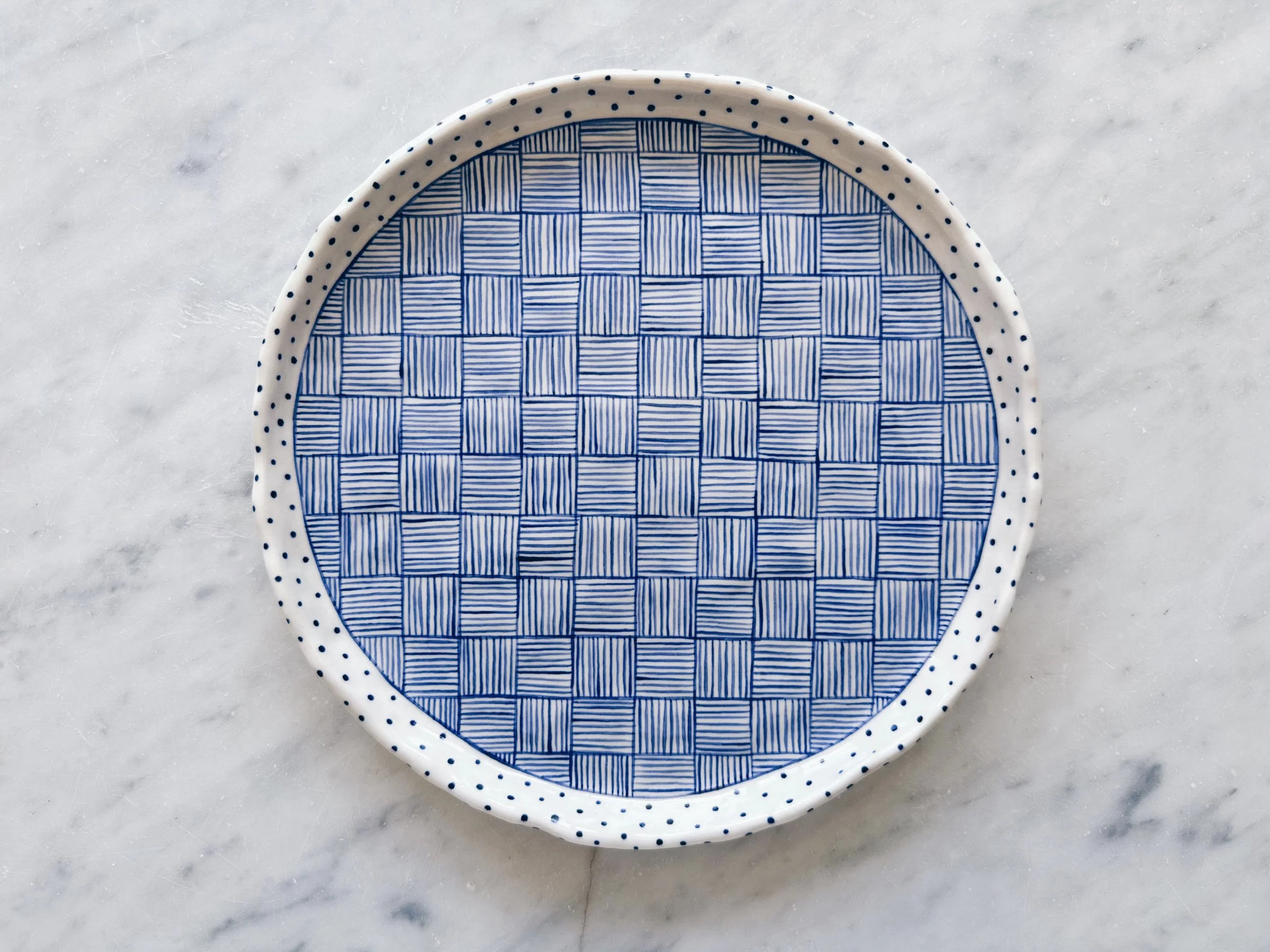 Blue and white, handmade ceramic plate.