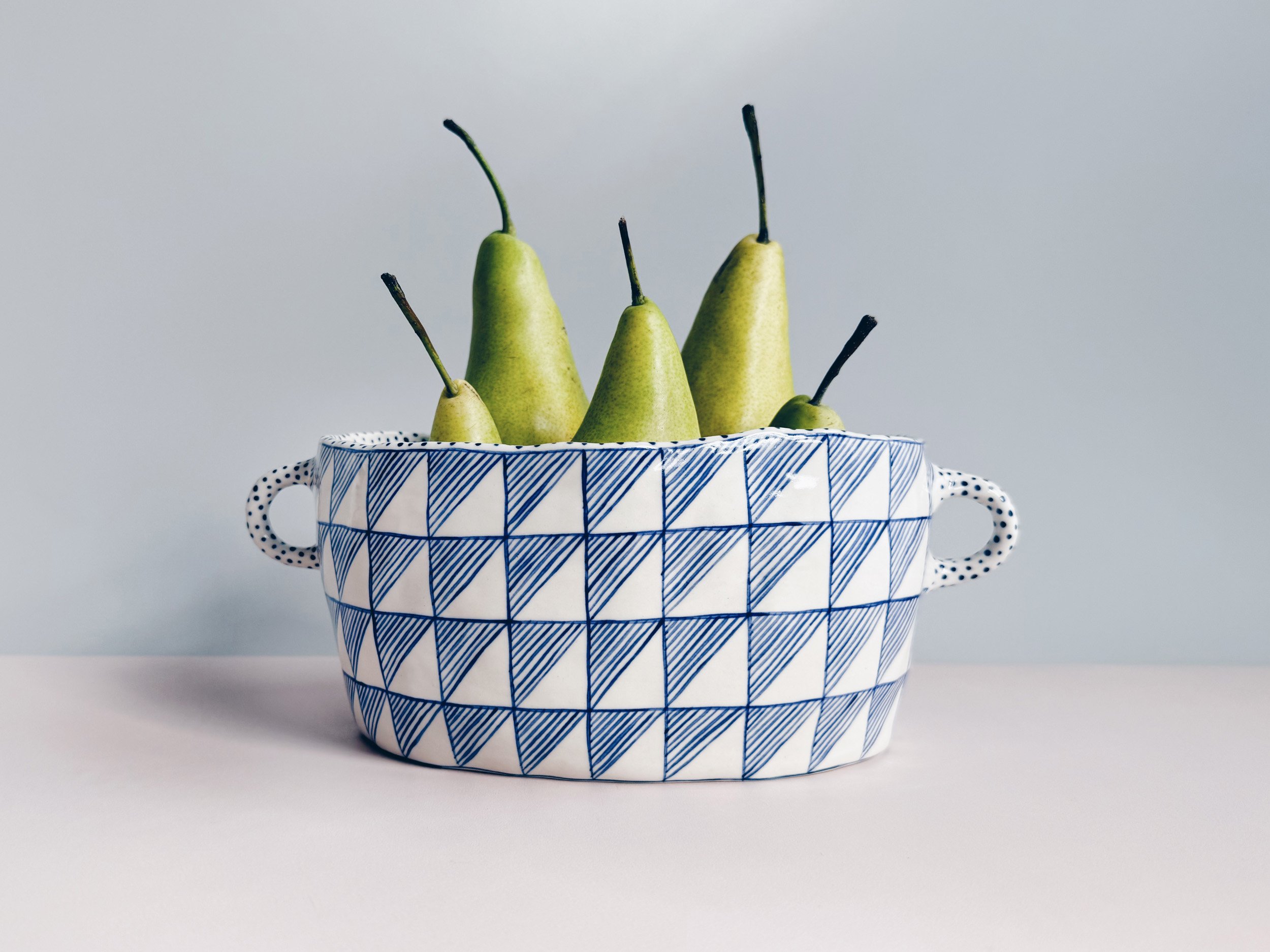 Blue and white, handmade ceramic vessel.