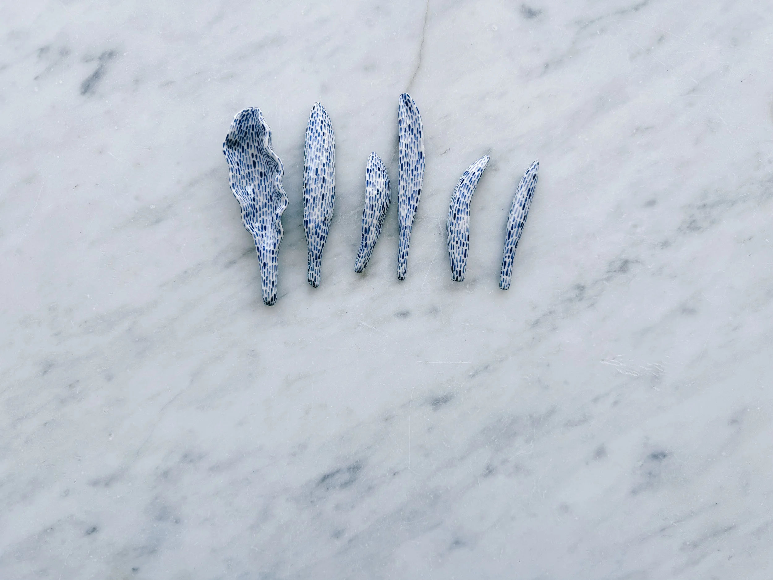 Blue and white, handmade ceramic sculpture.