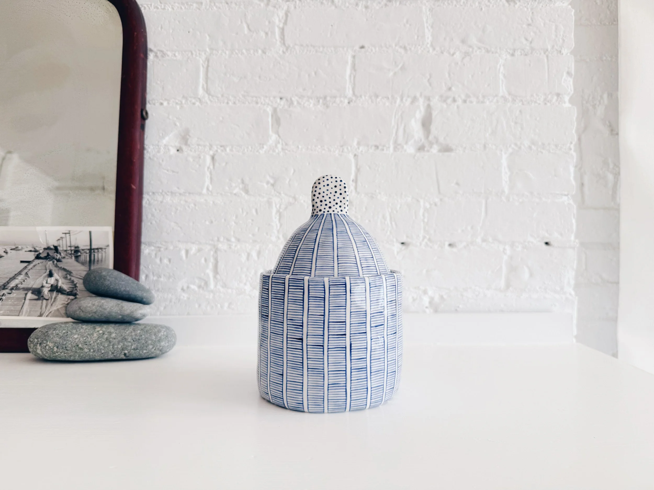 Blue and white, handmade ceramic jar.