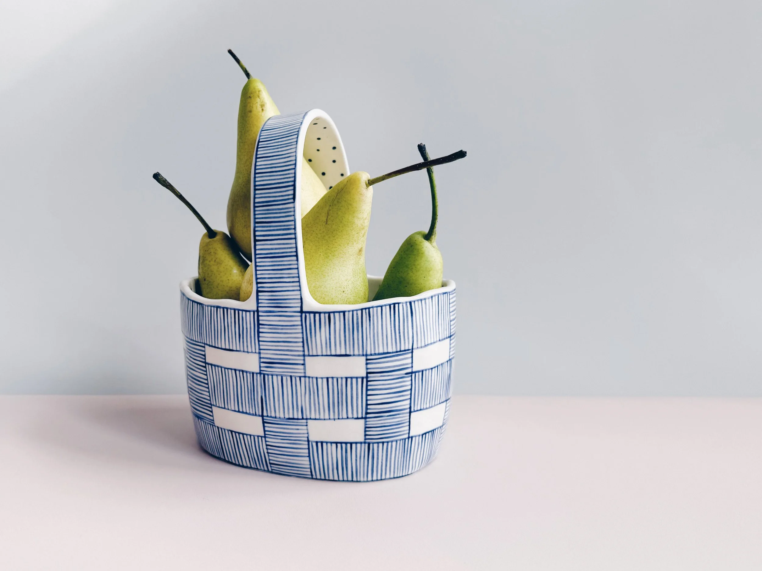 Blue and white, handmade ceramic vessel.