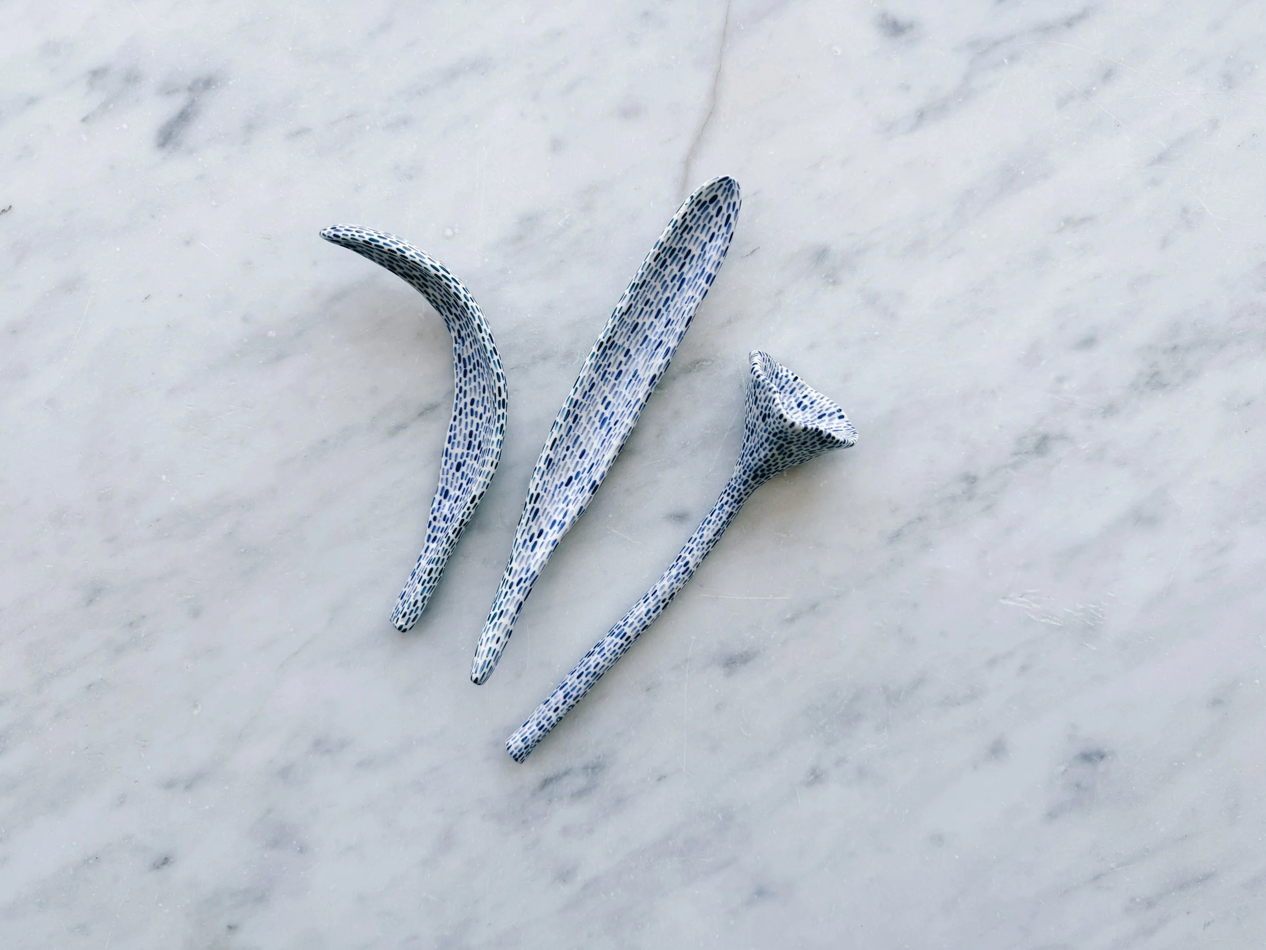 Blue and white, handmade ceramic sculpture.