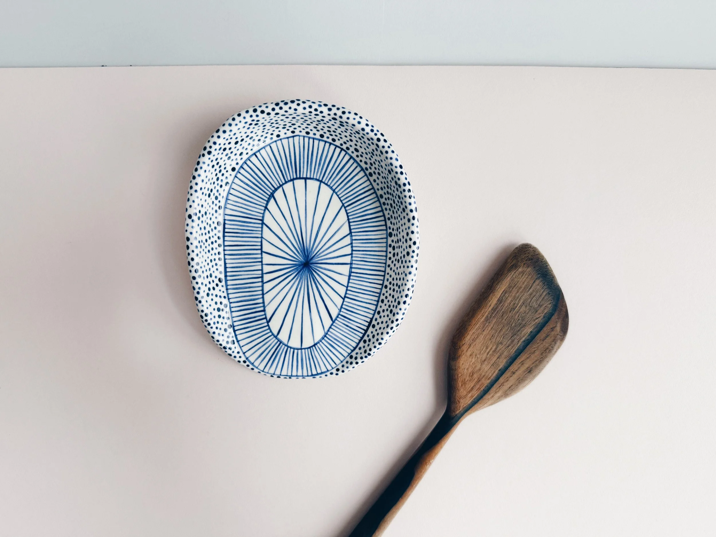 Blue and white, handmade ceramic spoon rest.