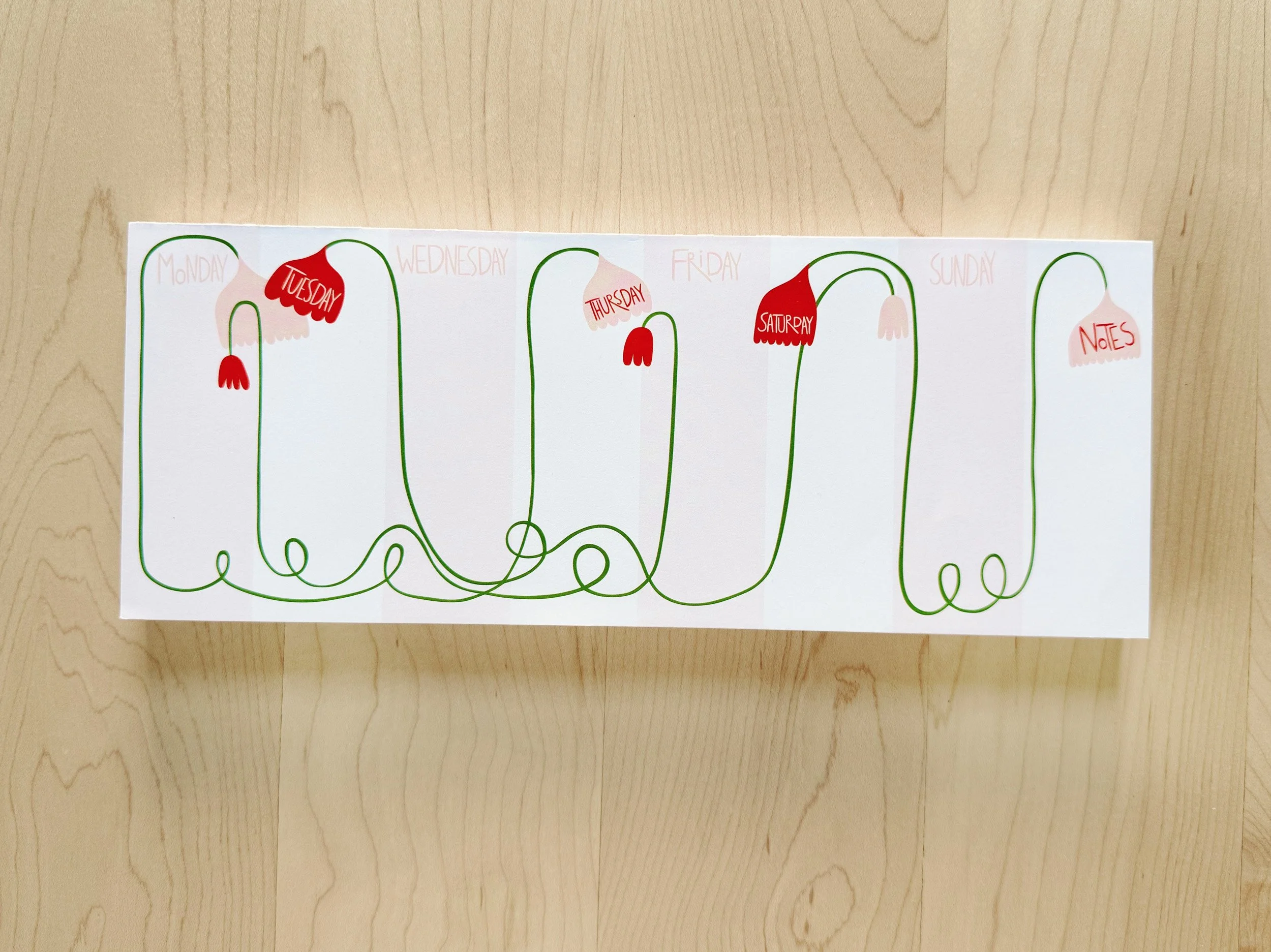 Weekly calendar notepad with floral design