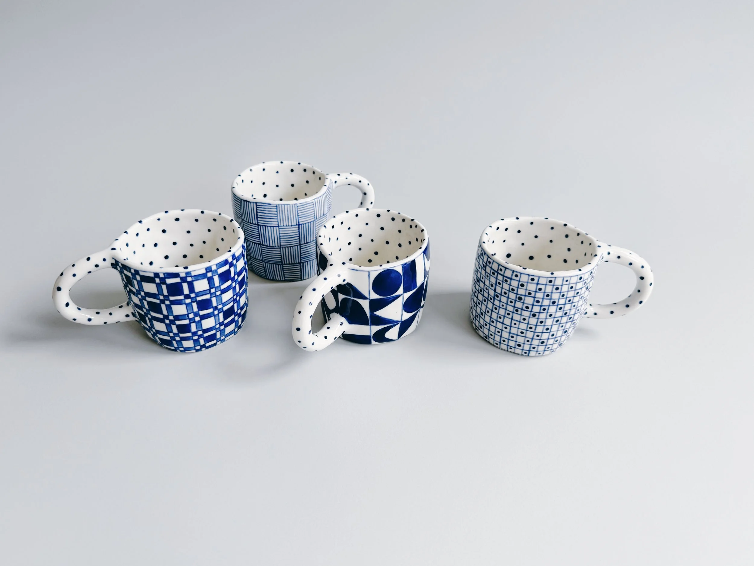 Blue and white, handmade ceramic mug.