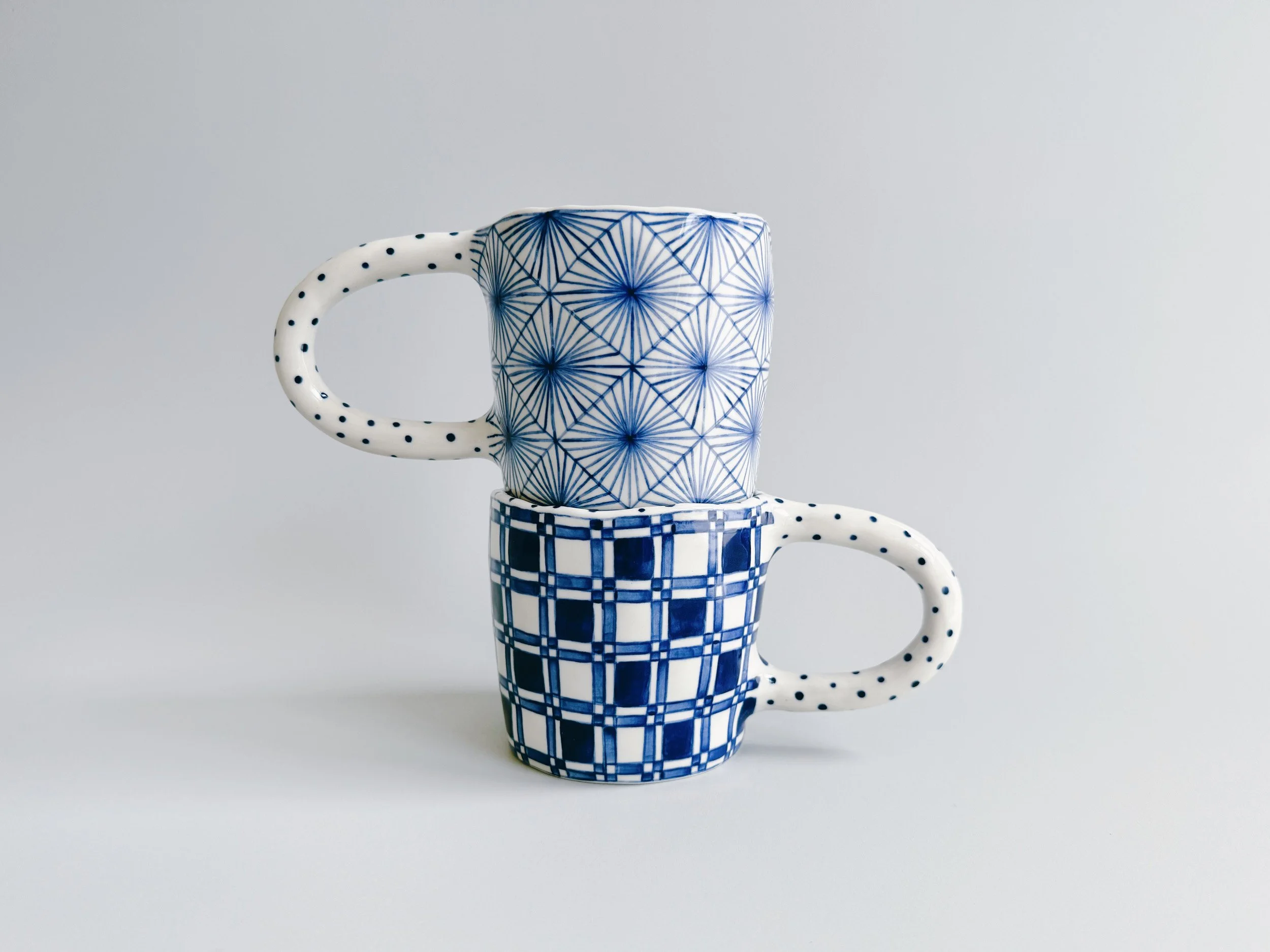 Blue and white, handmade ceramic mug.