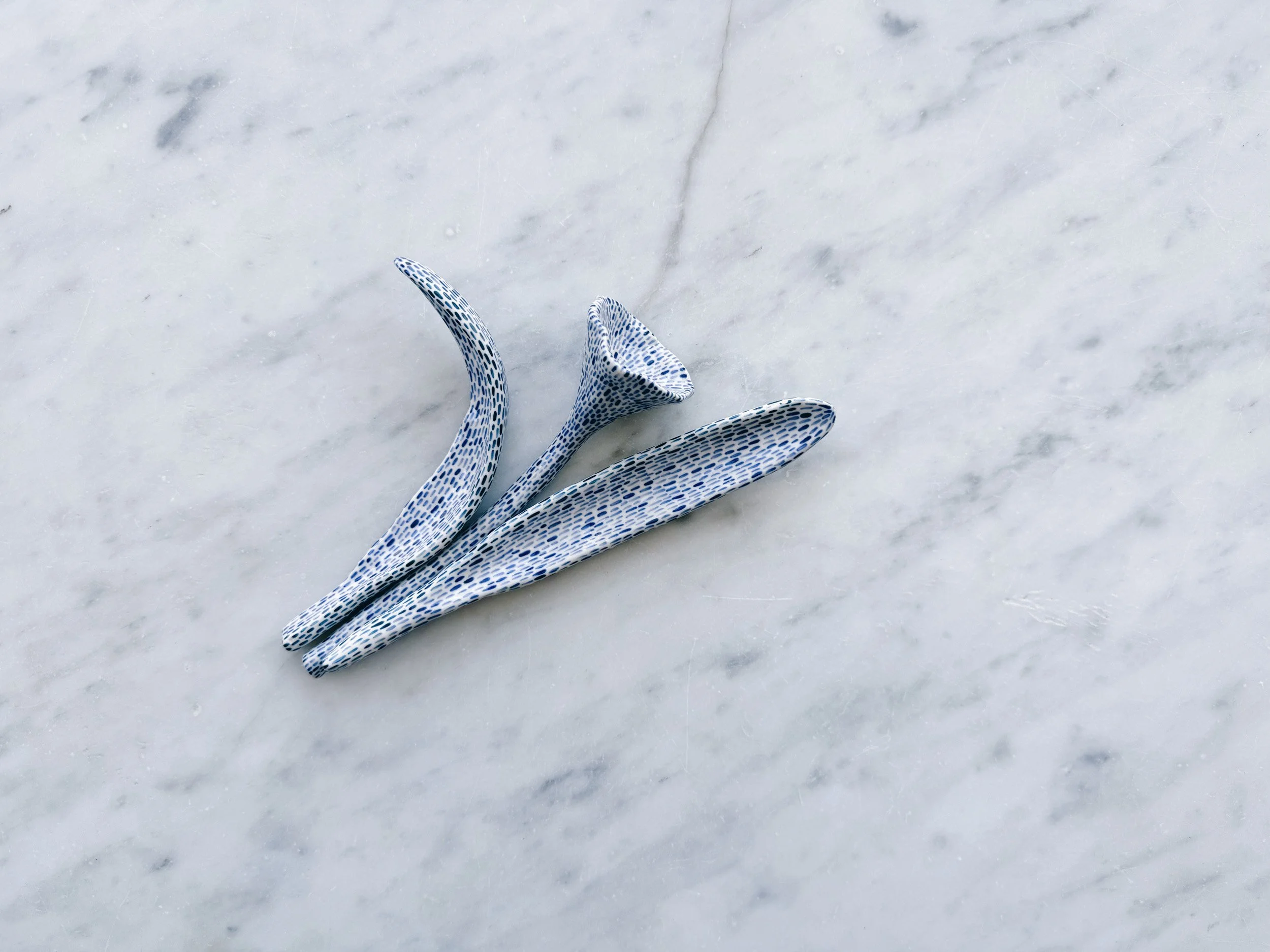 Blue and white, handmade ceramic sculpture.