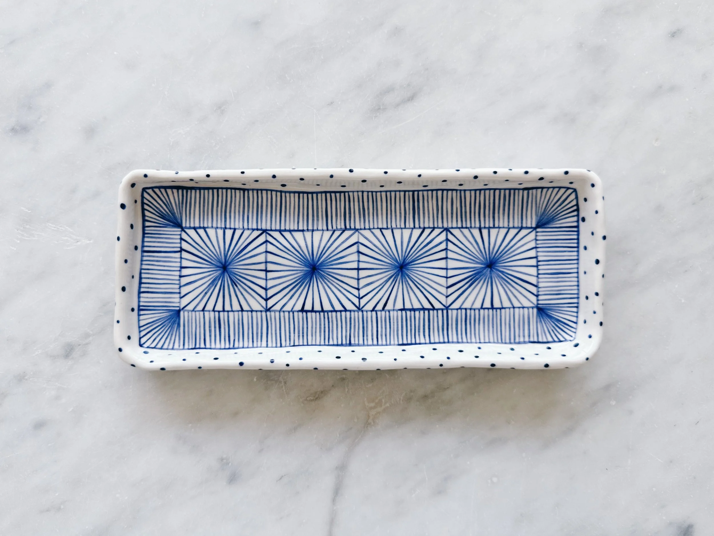 Blue and white, handmade ceramic plate.