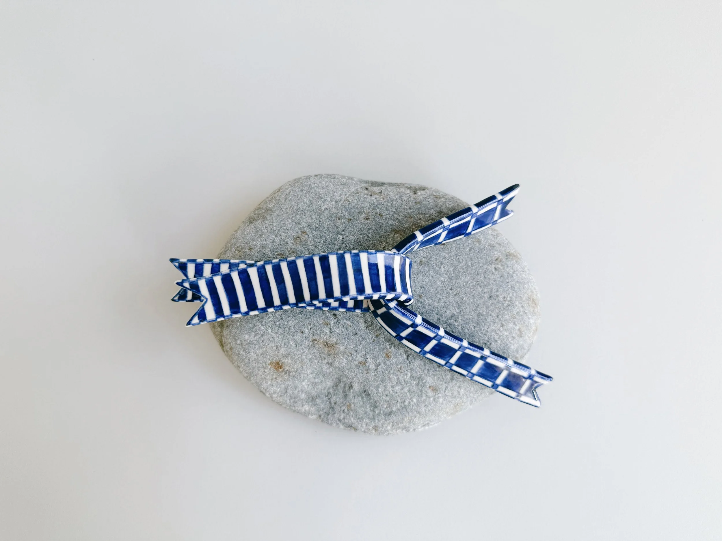 Blue and white, handmade ceramic ribbon