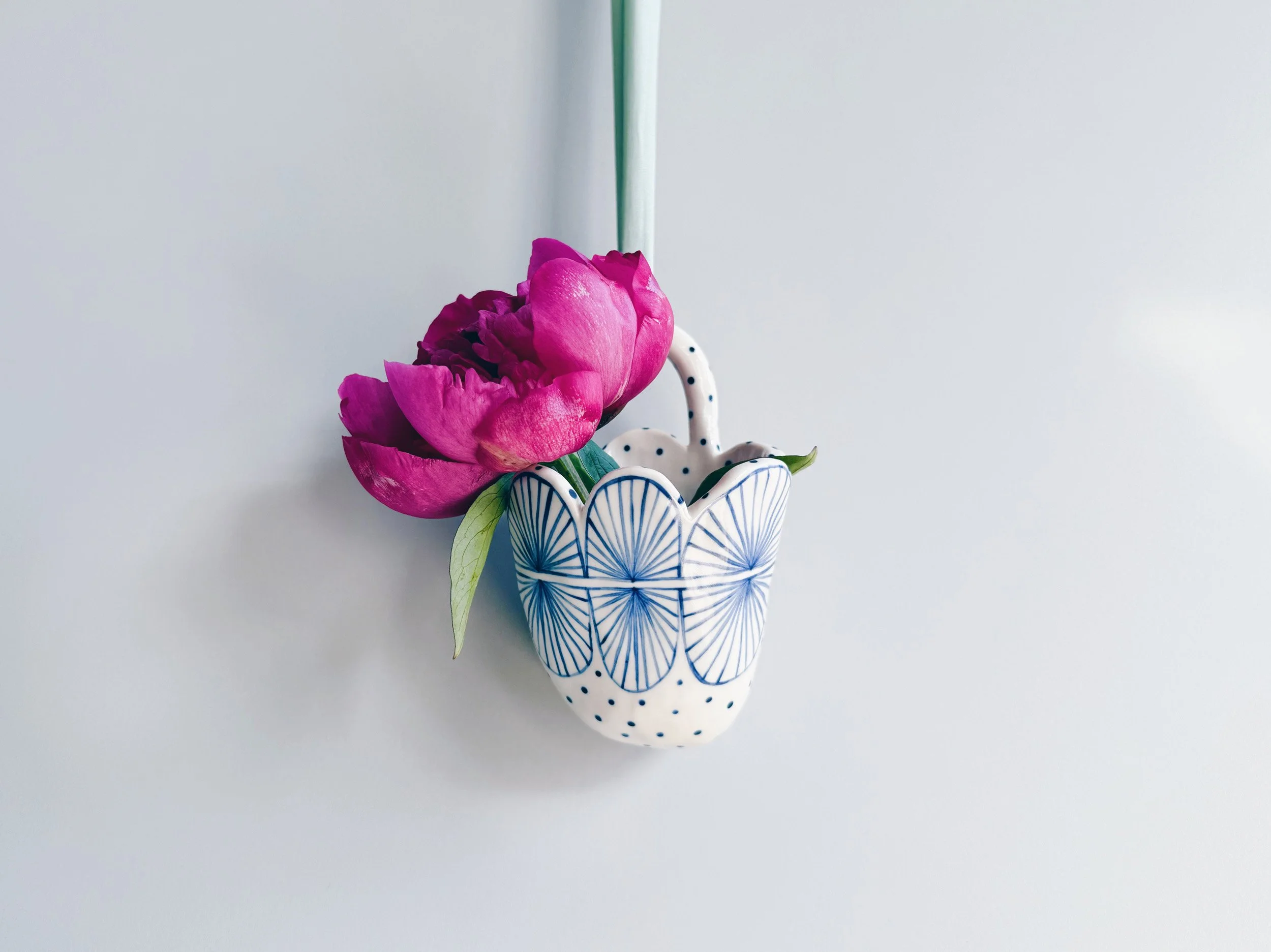 Blue and white, handmade ceramic vessel.