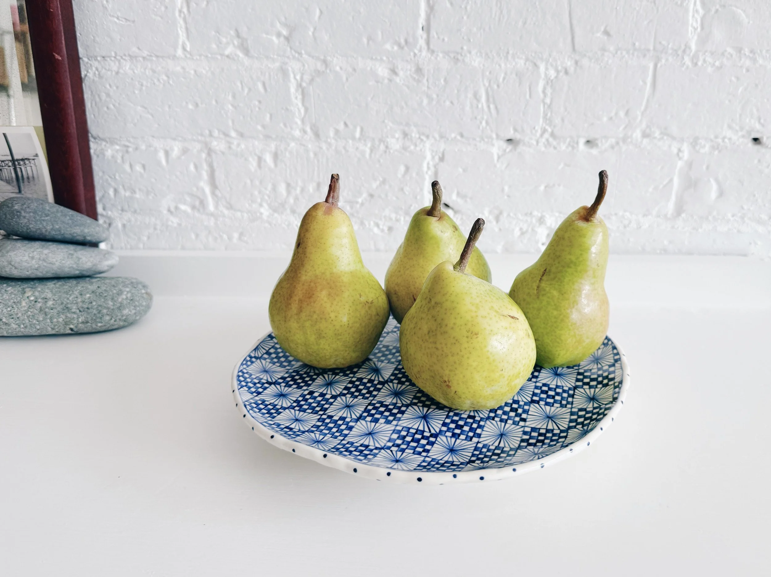 Blue and white, handmade ceramic raised plate.