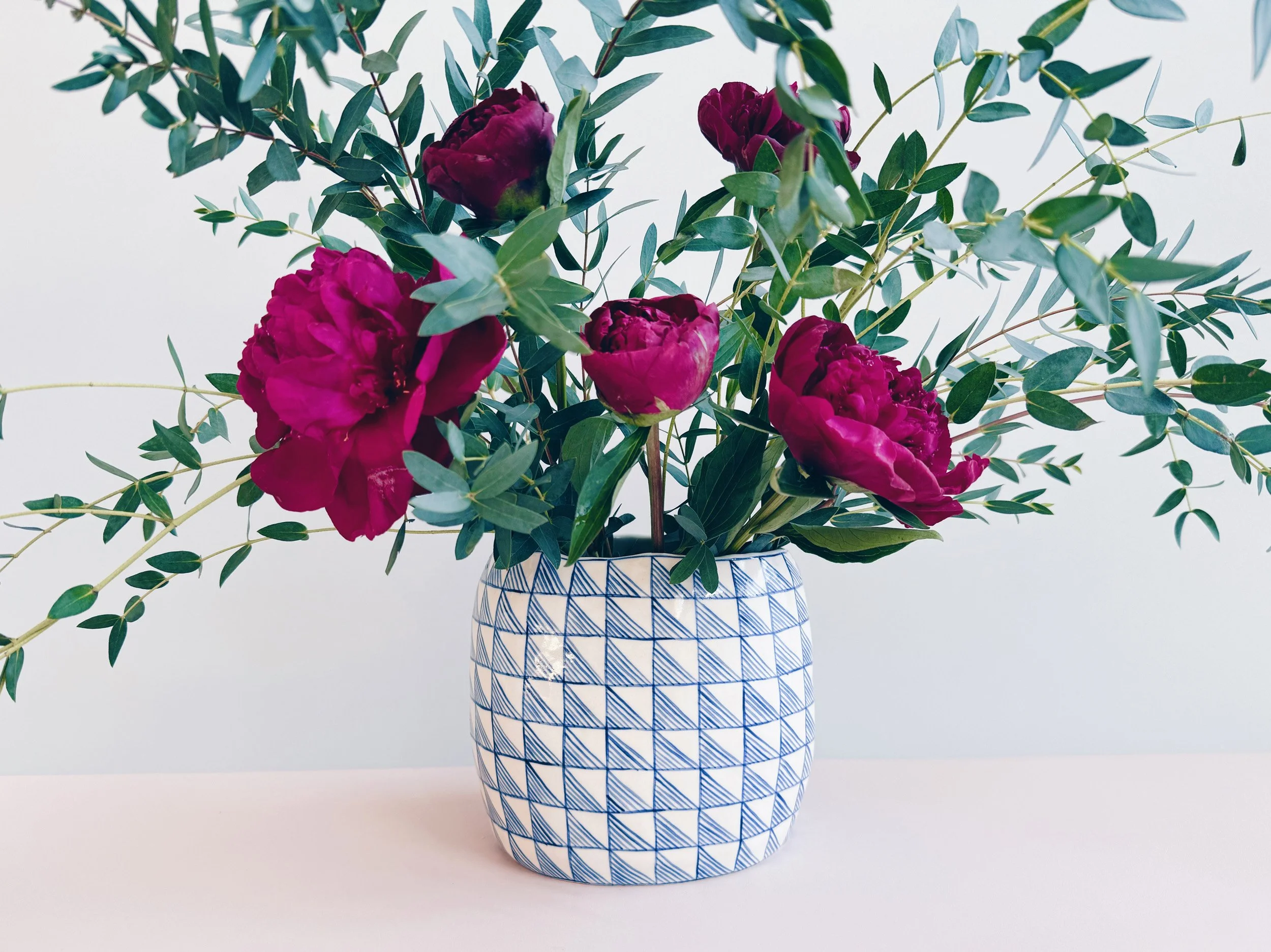 Blue and white, handmade ceramic vase.
