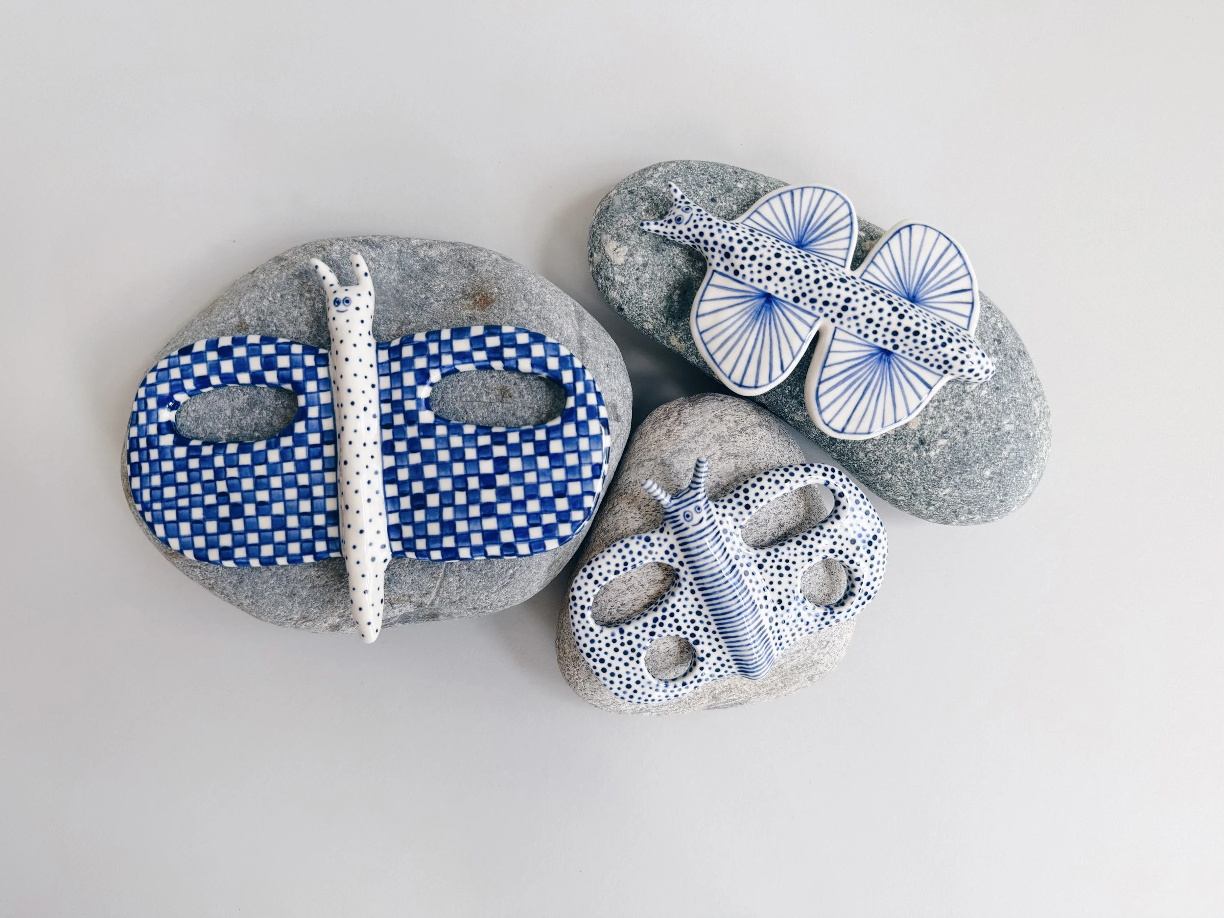 Blue and white, handmade ceramic butterfly.