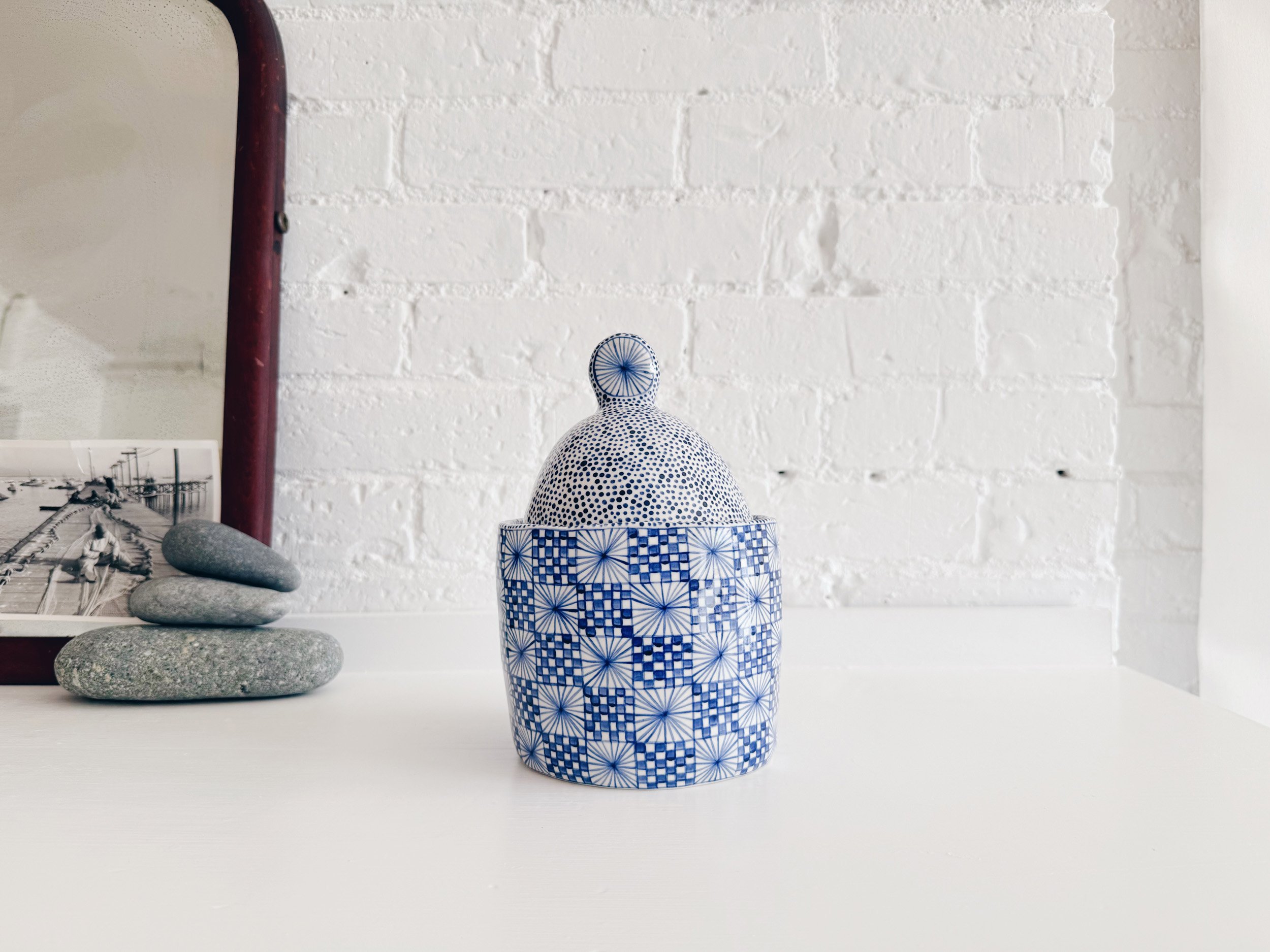 Blue and white, handmade ceramic jar.