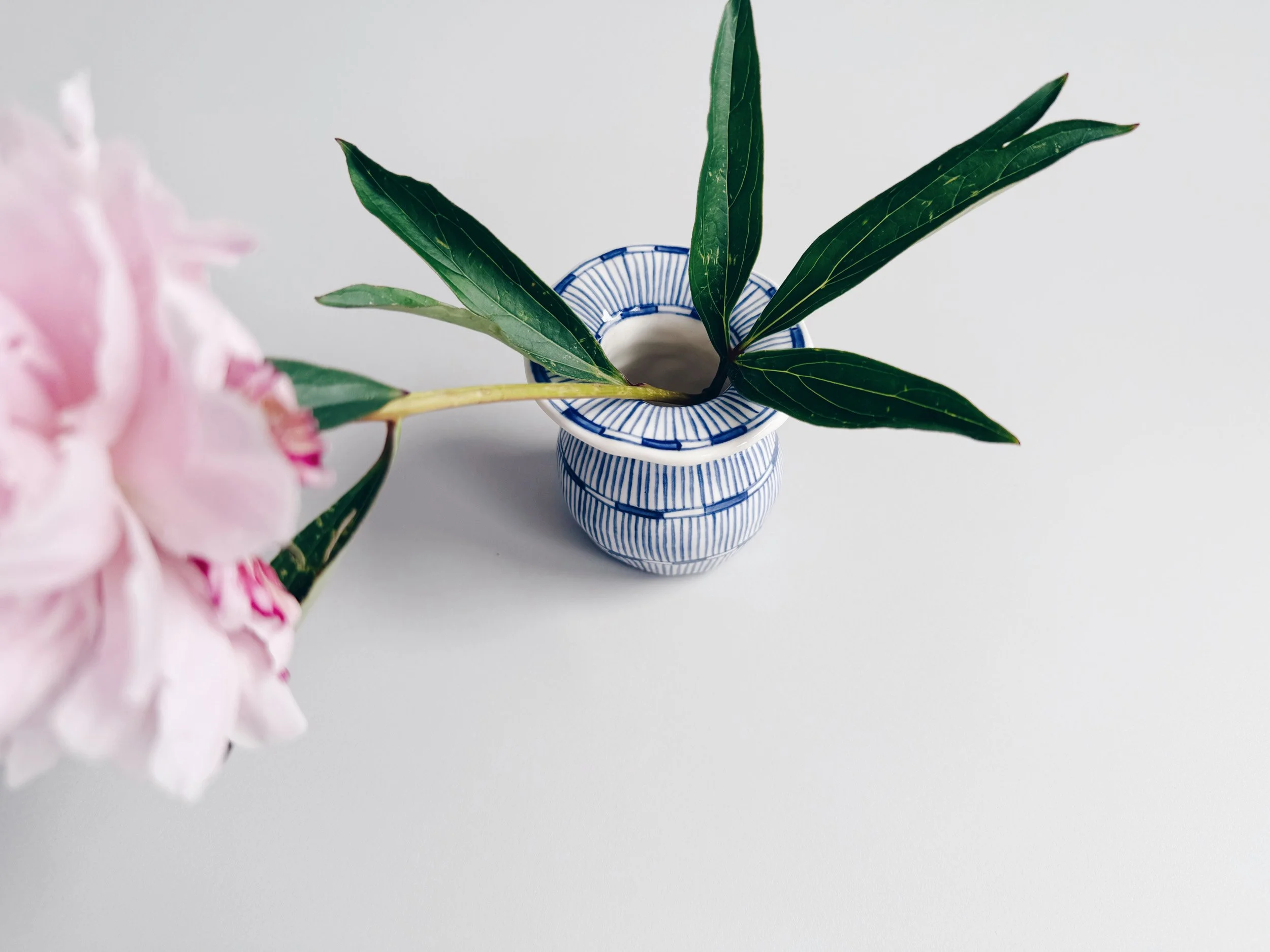 Blue and white, handmade ceramic vase.
