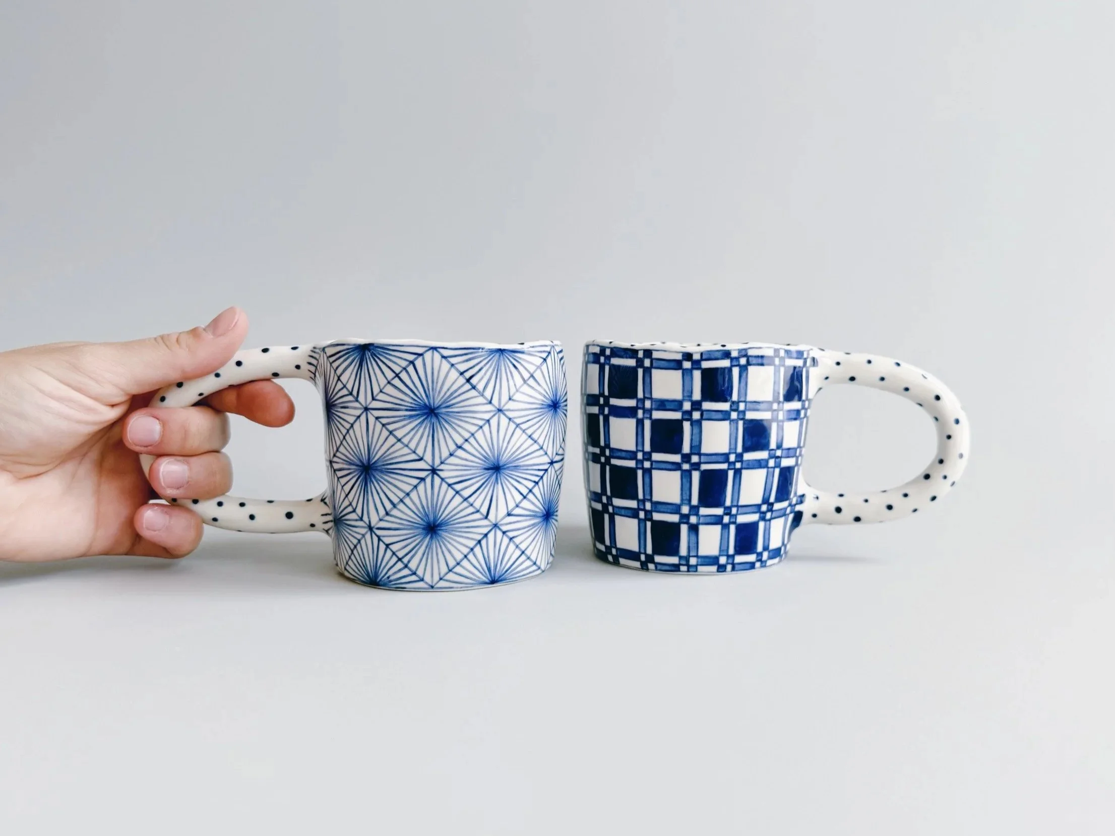 Blue and white, handmade ceramic mug.