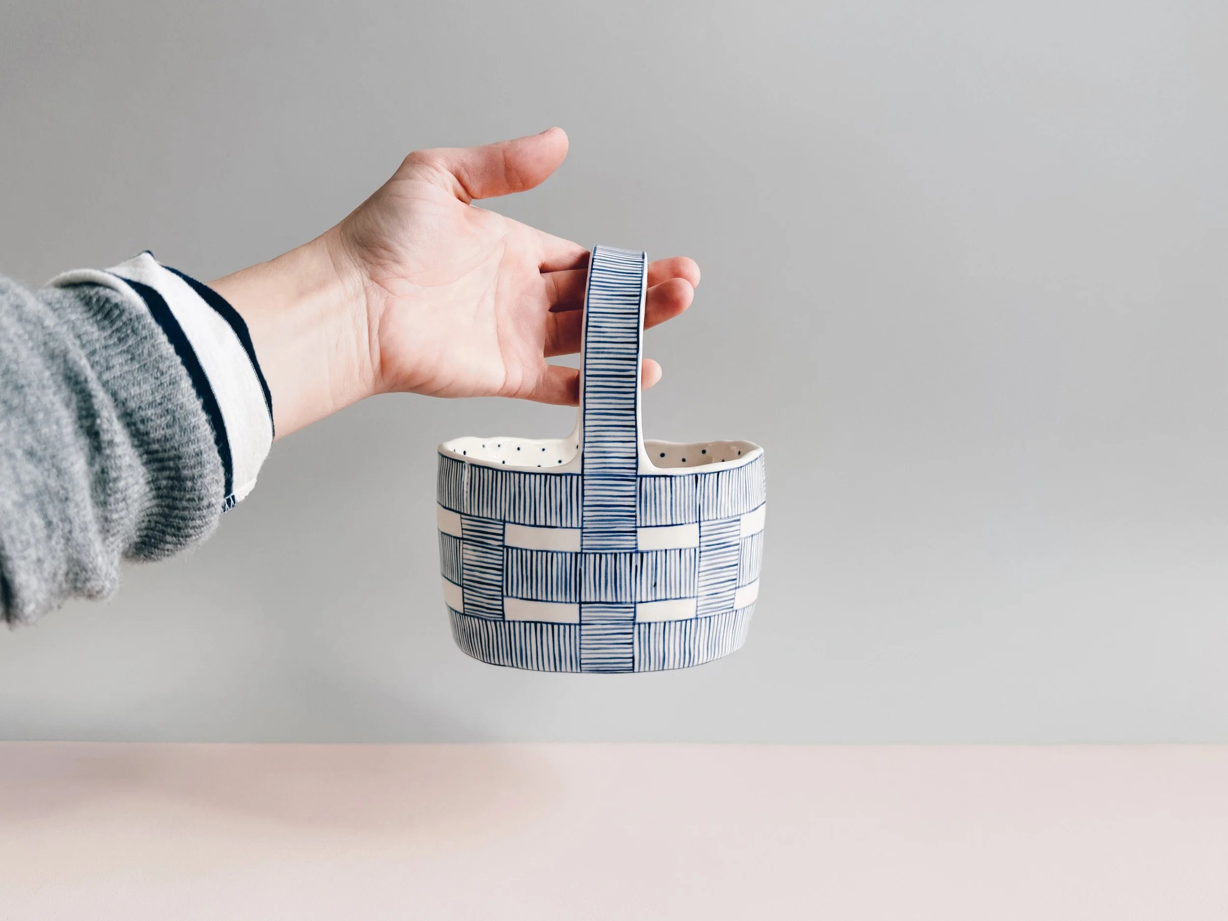 Blue and white, handmade ceramic vessel.
