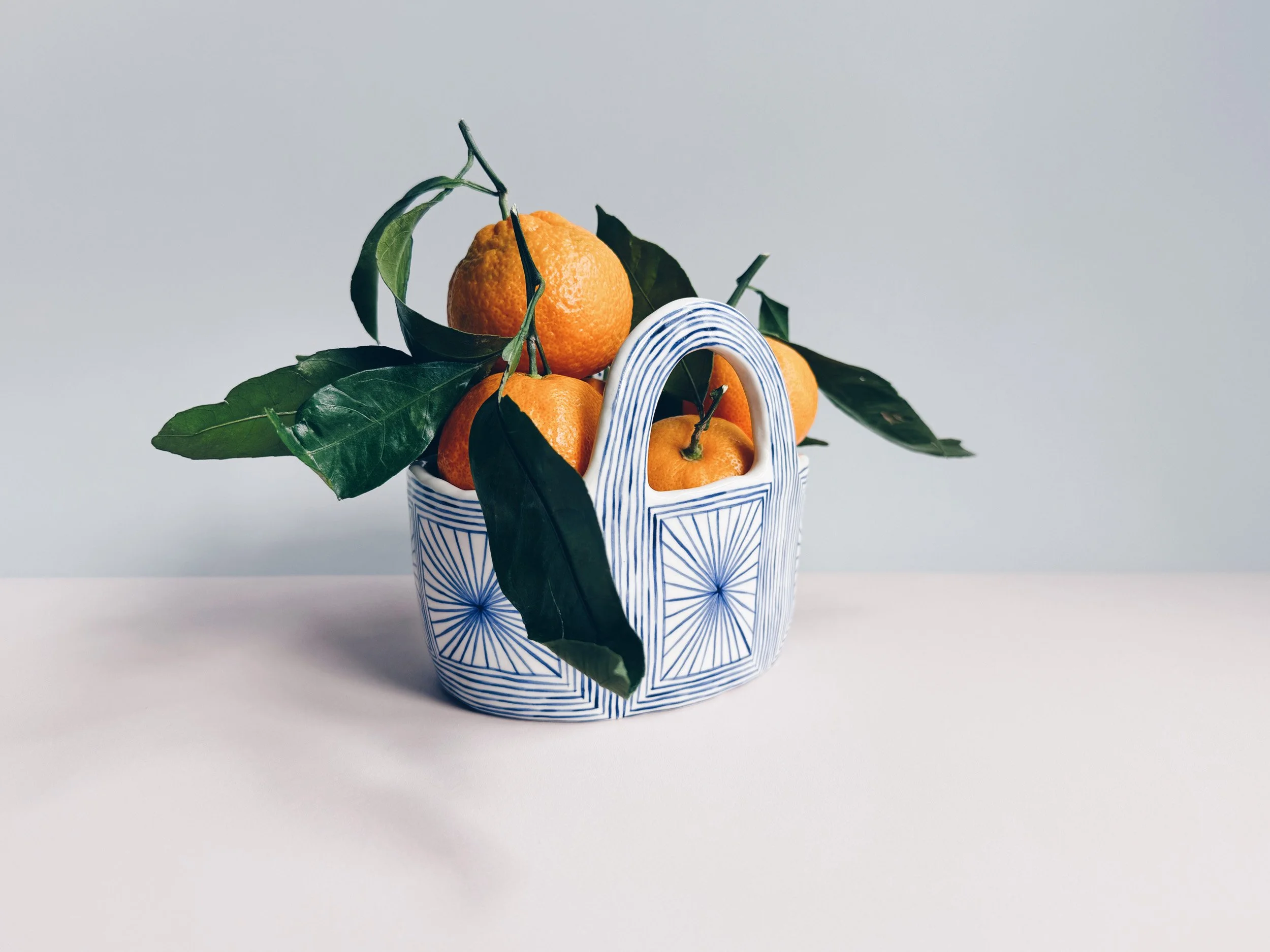 Blue and white, handmade ceramic vessel.