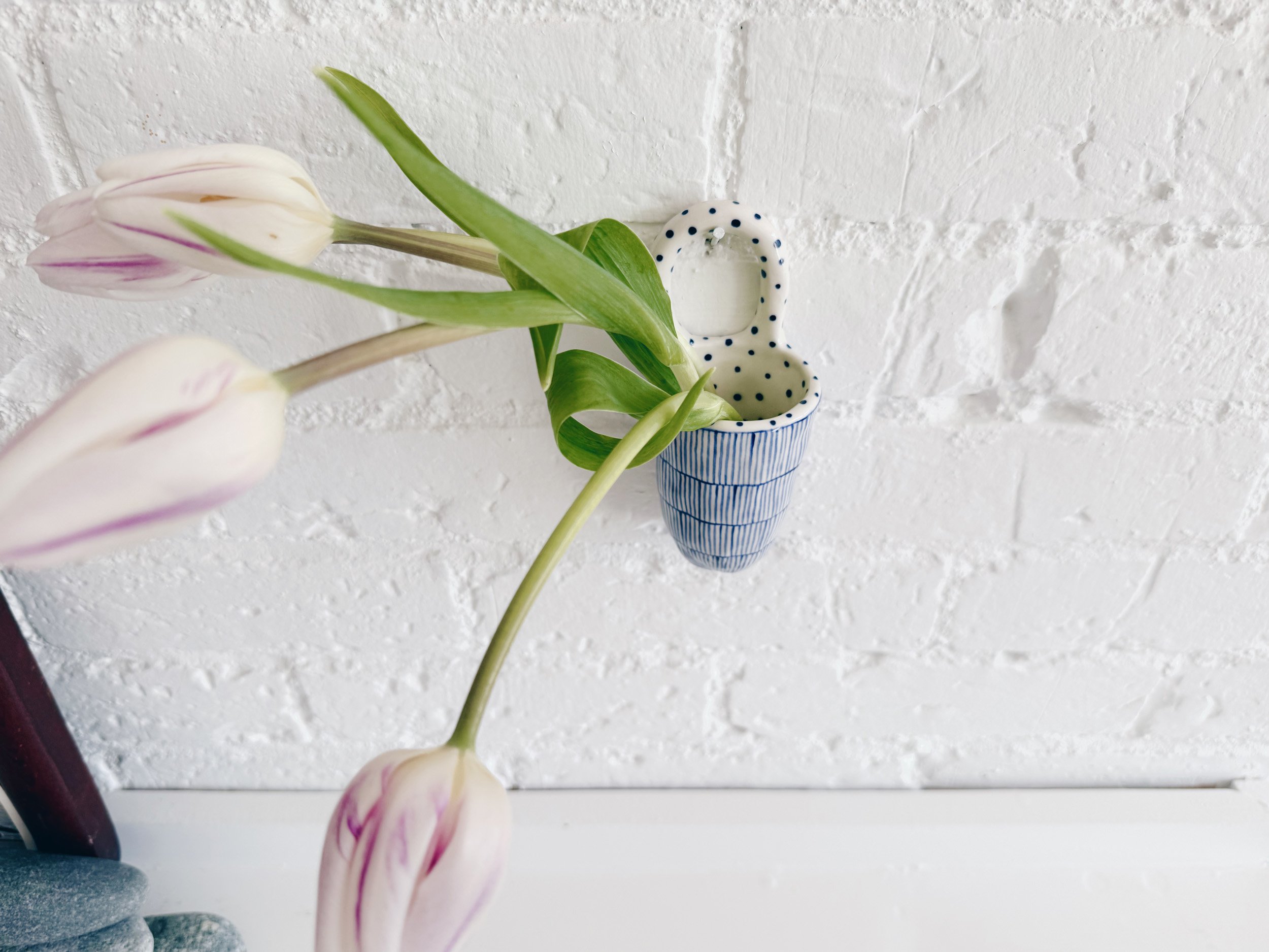 Blue and white, handmade ceramic vessel.