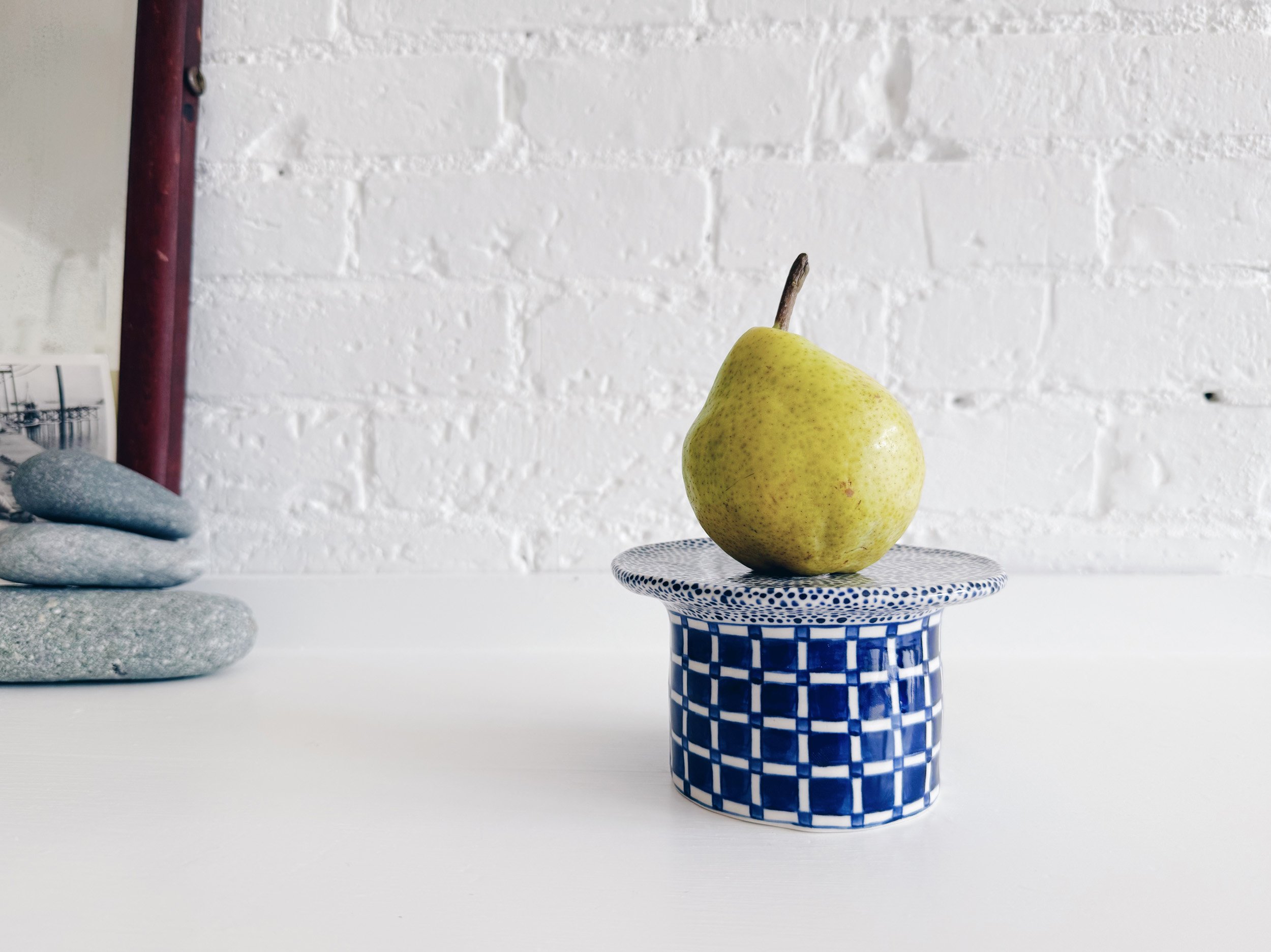 Blue and white, handmade ceramic raised plate.