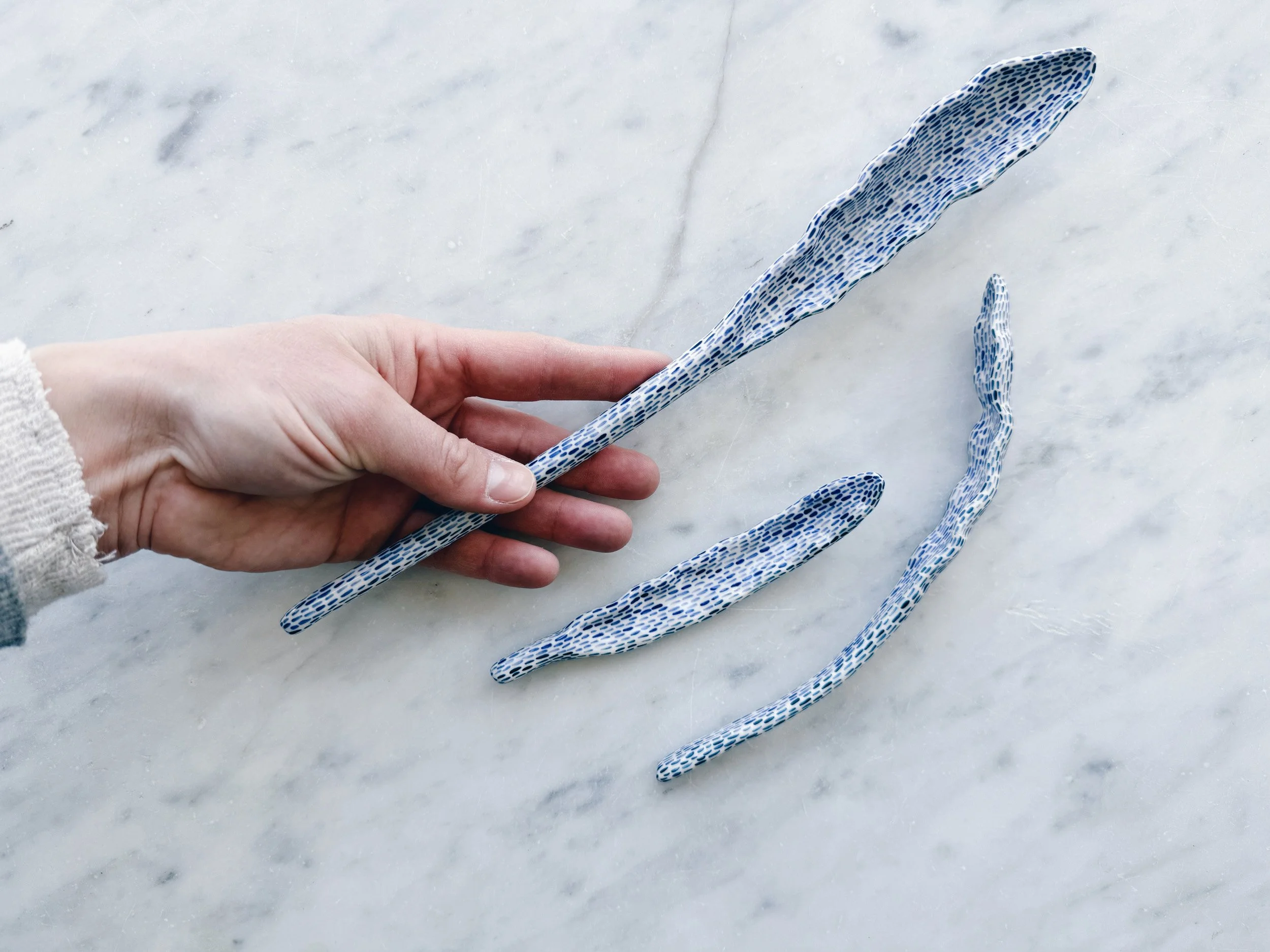 Blue and white, handmade ceramic sculpture.