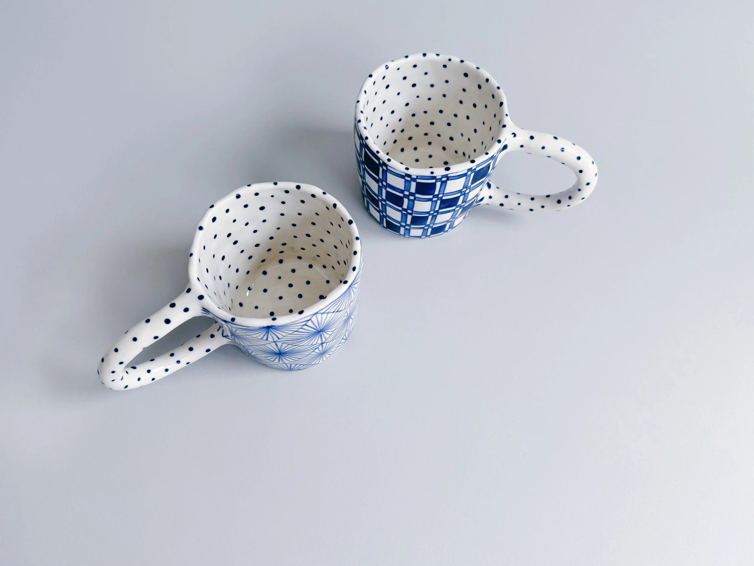 Blue and white, handmade ceramic mug.