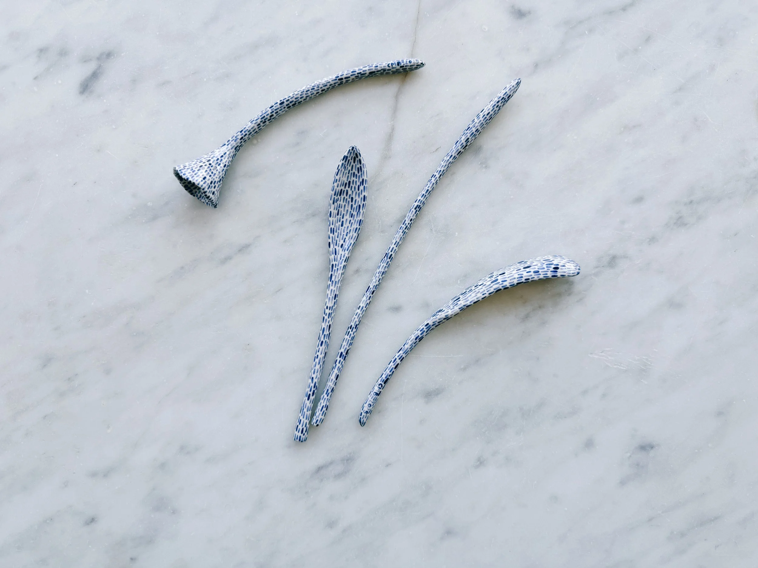 Blue and white, handmade ceramic sculpture.