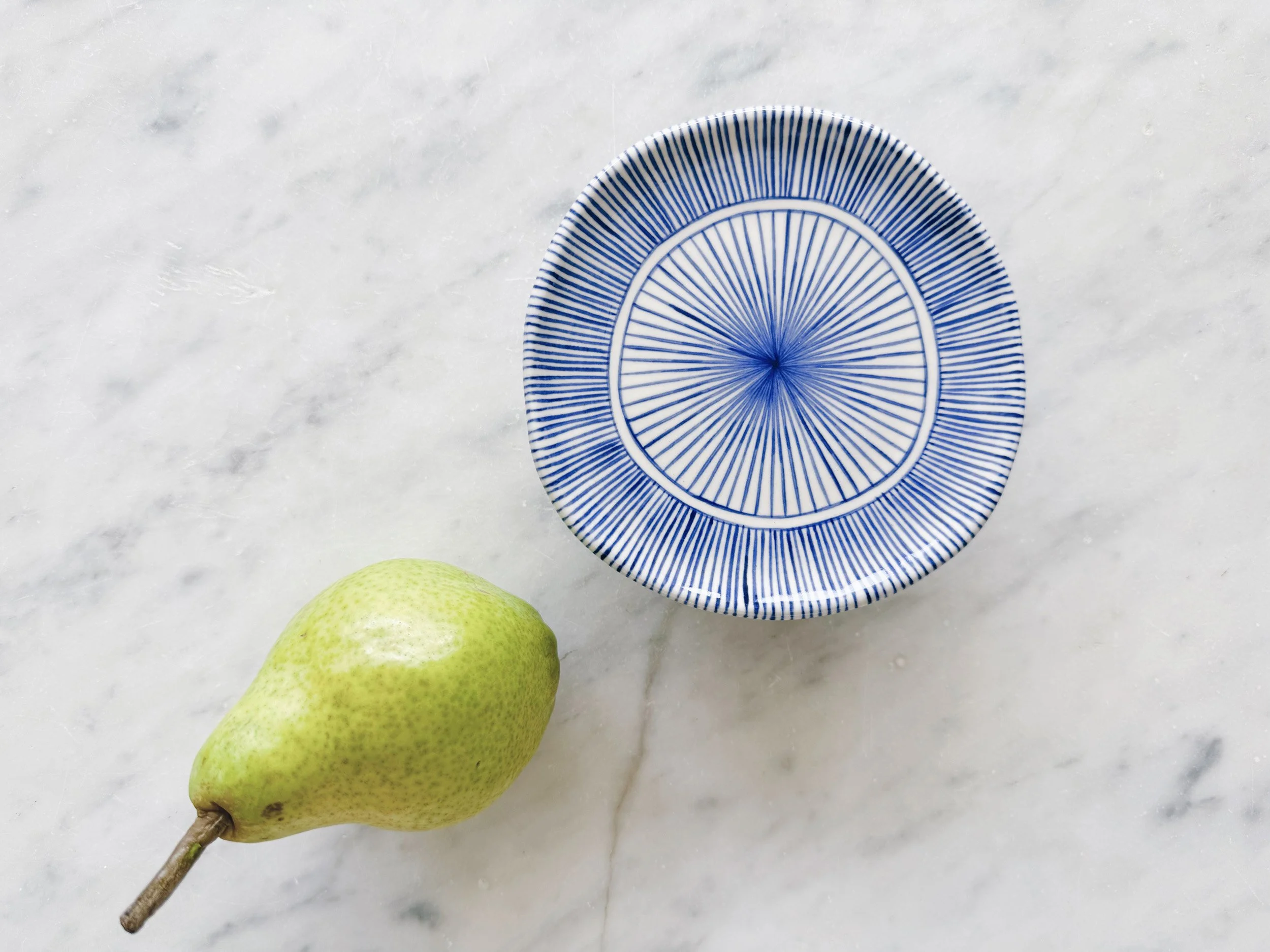 Blue and white, handmade ceramic raised plate.