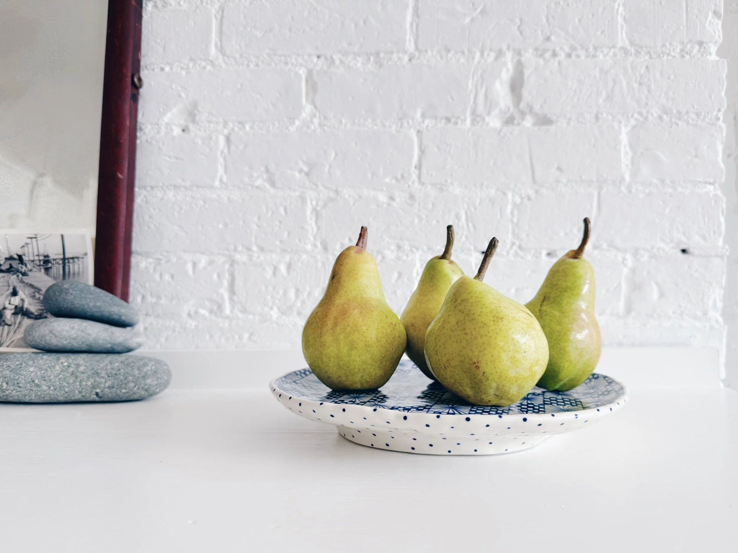 Blue and white, handmade ceramic raised plate.