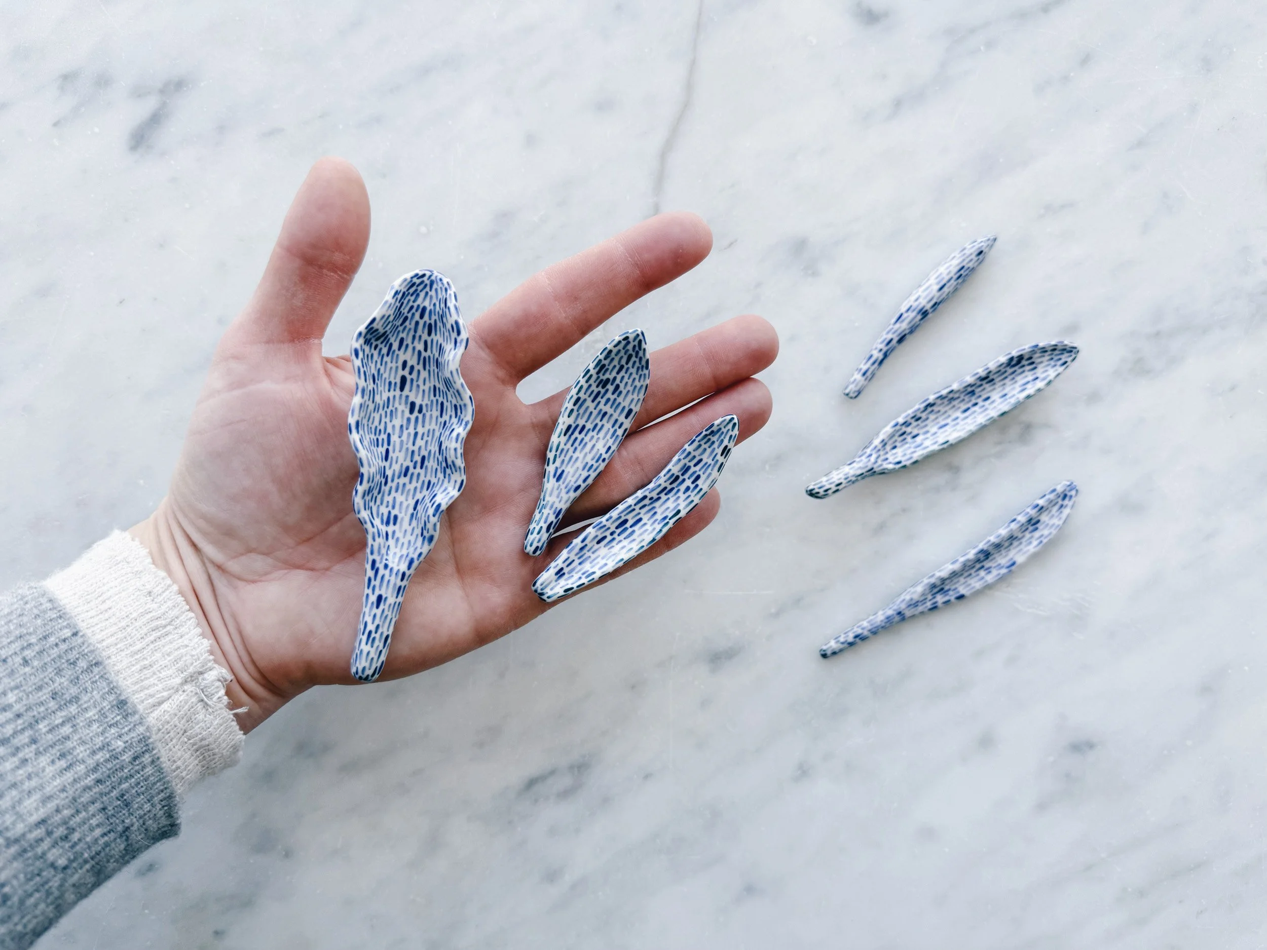 Blue and white, handmade ceramic sculpture.